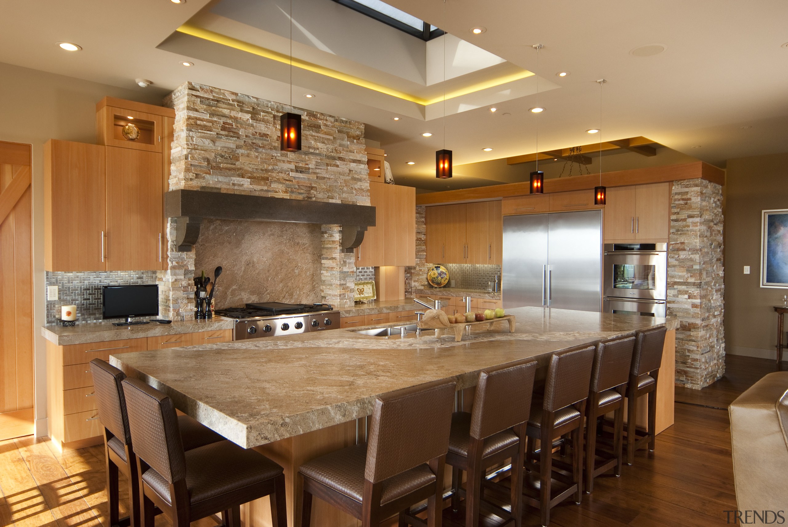 View of kitchen with wooden flooring, stone wall cabinetry, ceiling, countertop, cuisine classique, flooring, hardwood, interior design, kitchen, real estate, room, wood flooring, brown, orange