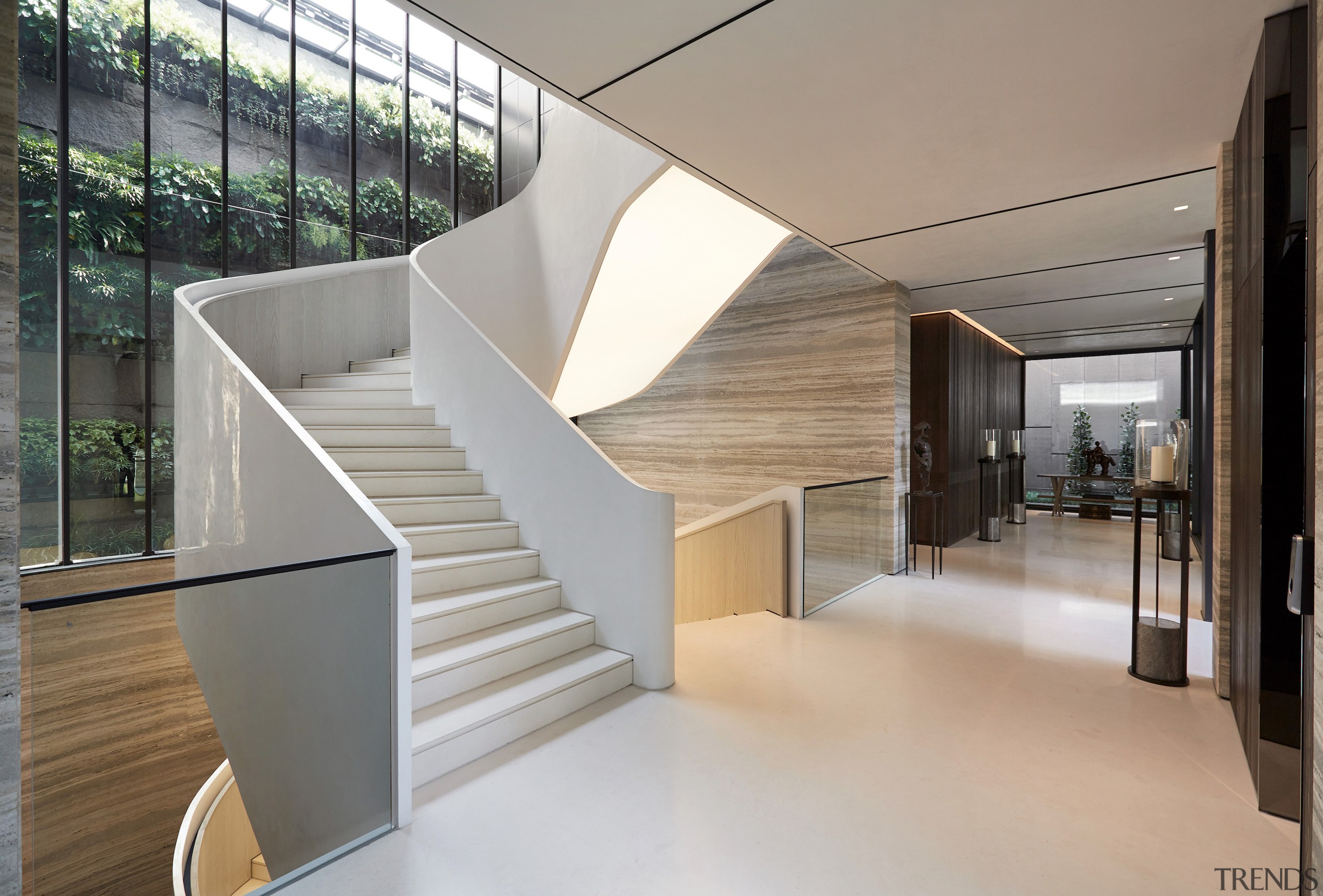 A wall of glass contributes to the staircase 
