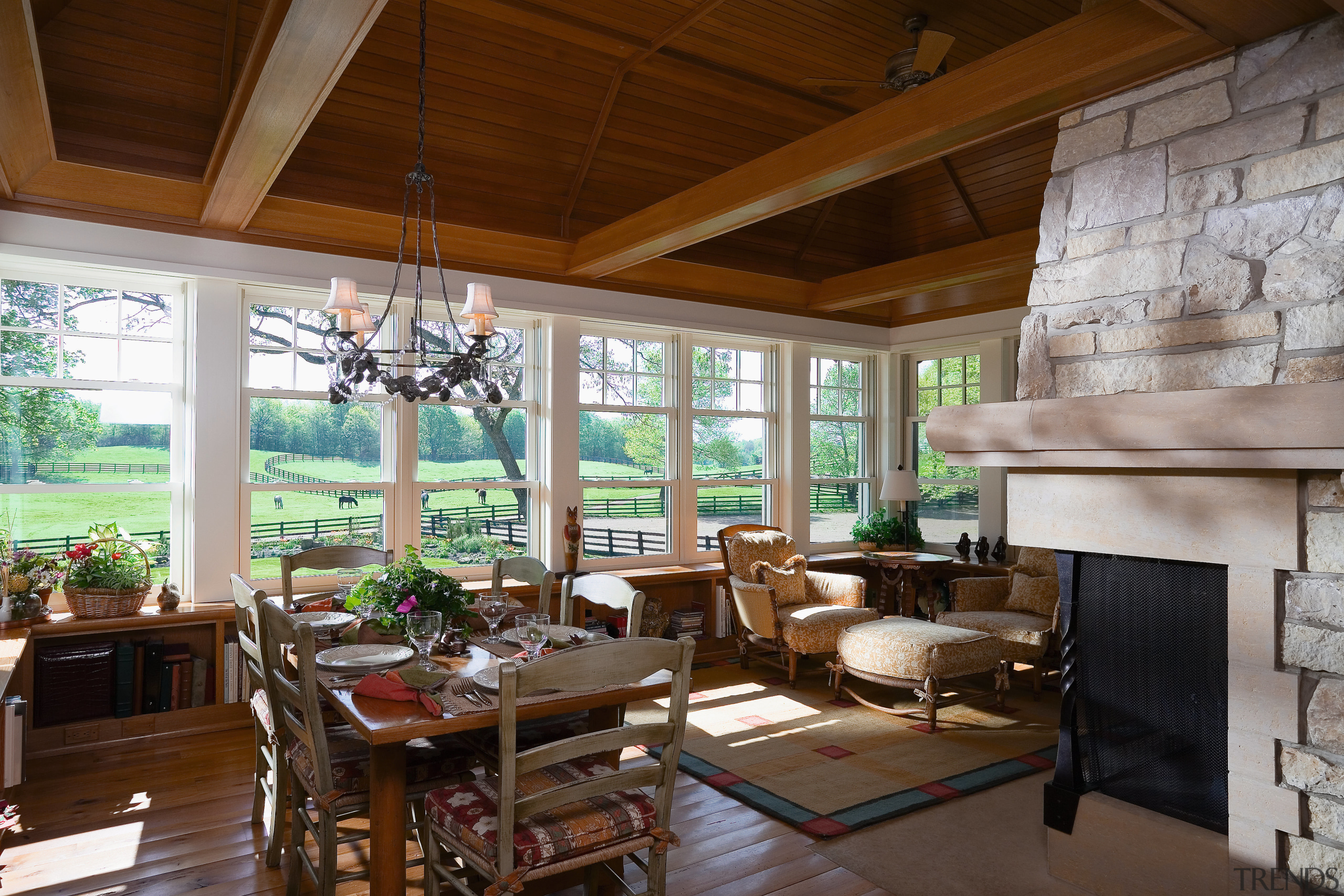 The kitchen and ajacent porch have a relaxed, home, interior design, living room, real estate, room, window, brown, gray