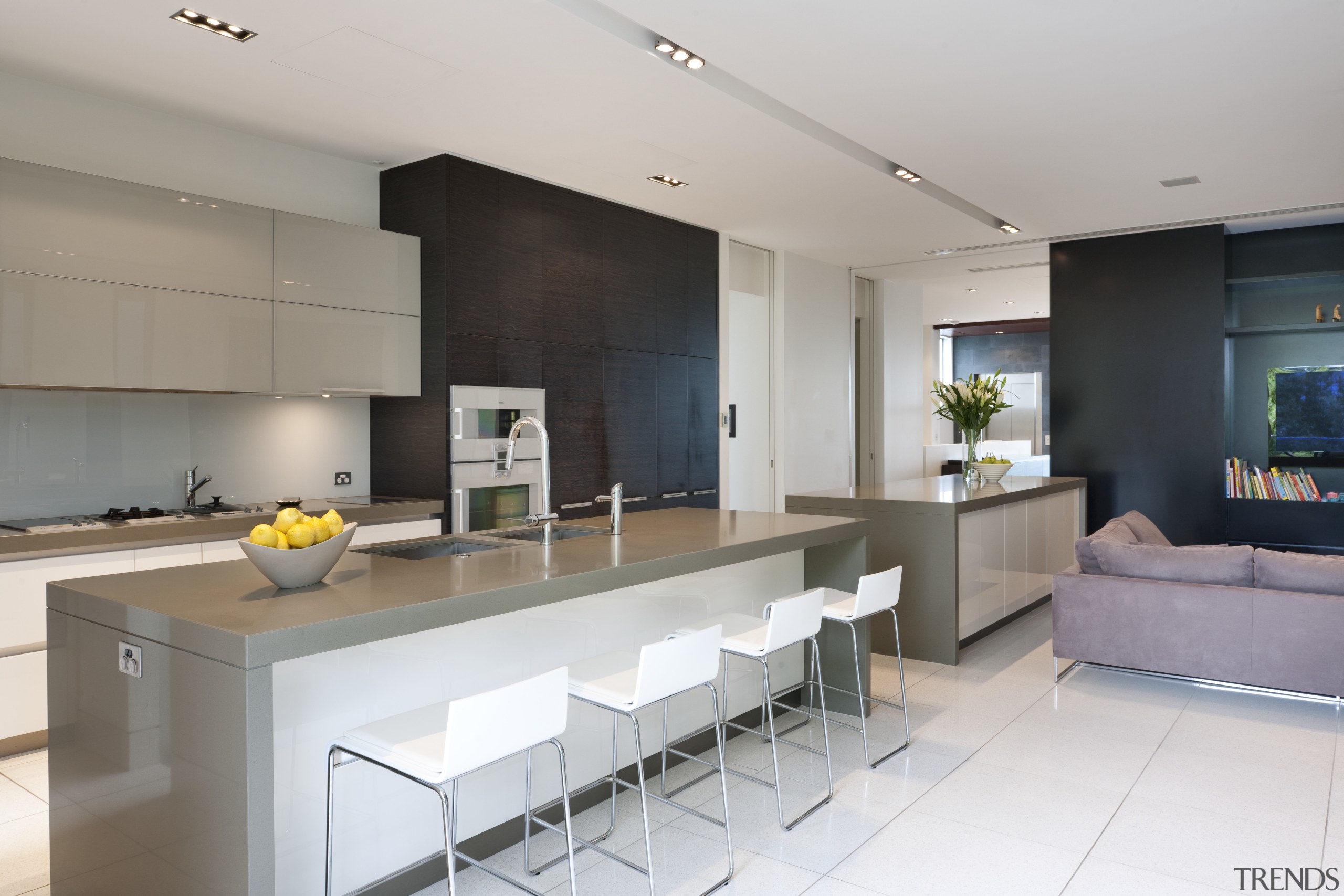 View of contemporary kitchen with light toned flooring, countertop, interior design, kitchen, real estate, gray