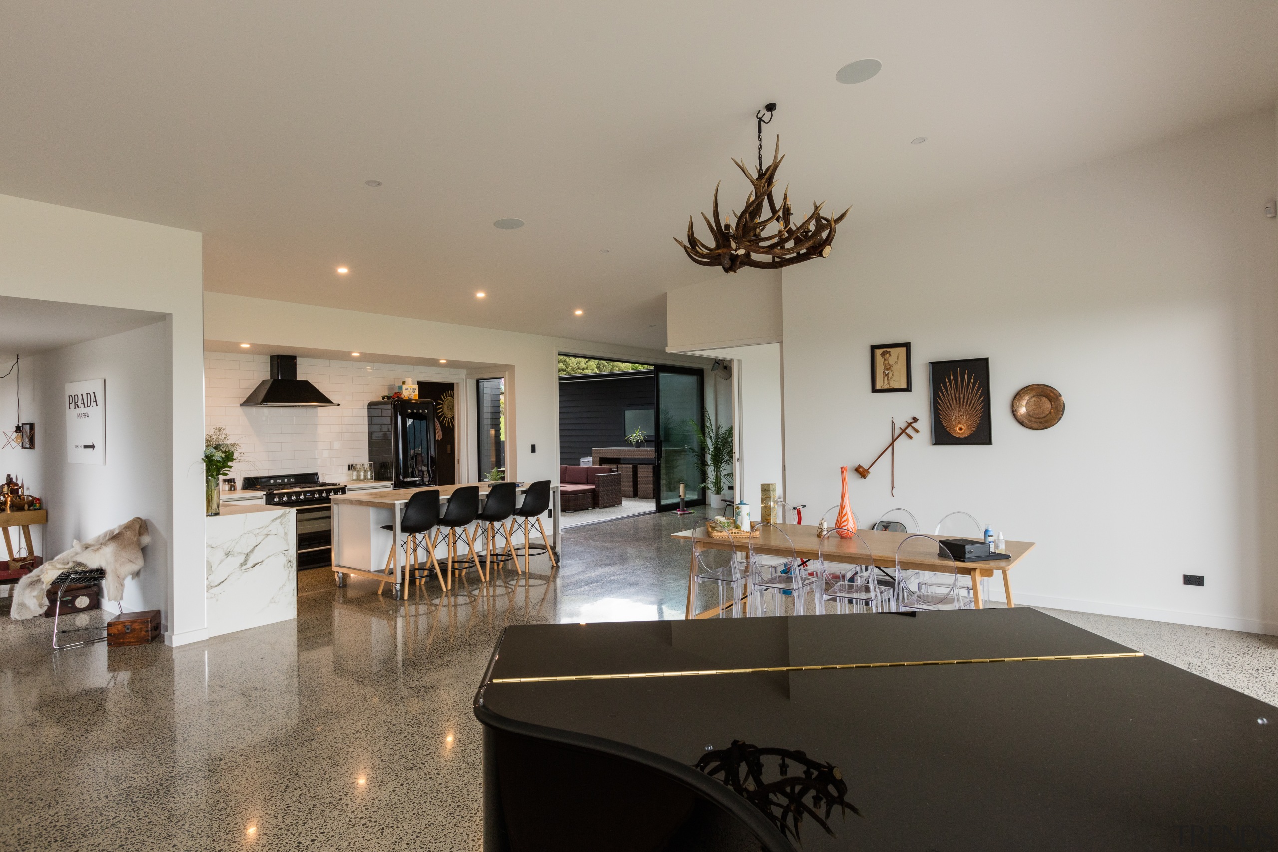This black and white kitchen all but disappears house, interior design, living room, real estate, room, gray
