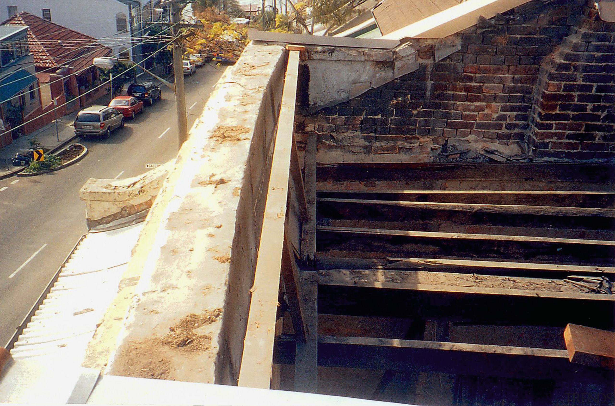 A exterior view of the apartment before it handrail, roof, stairs, wall, wood, black