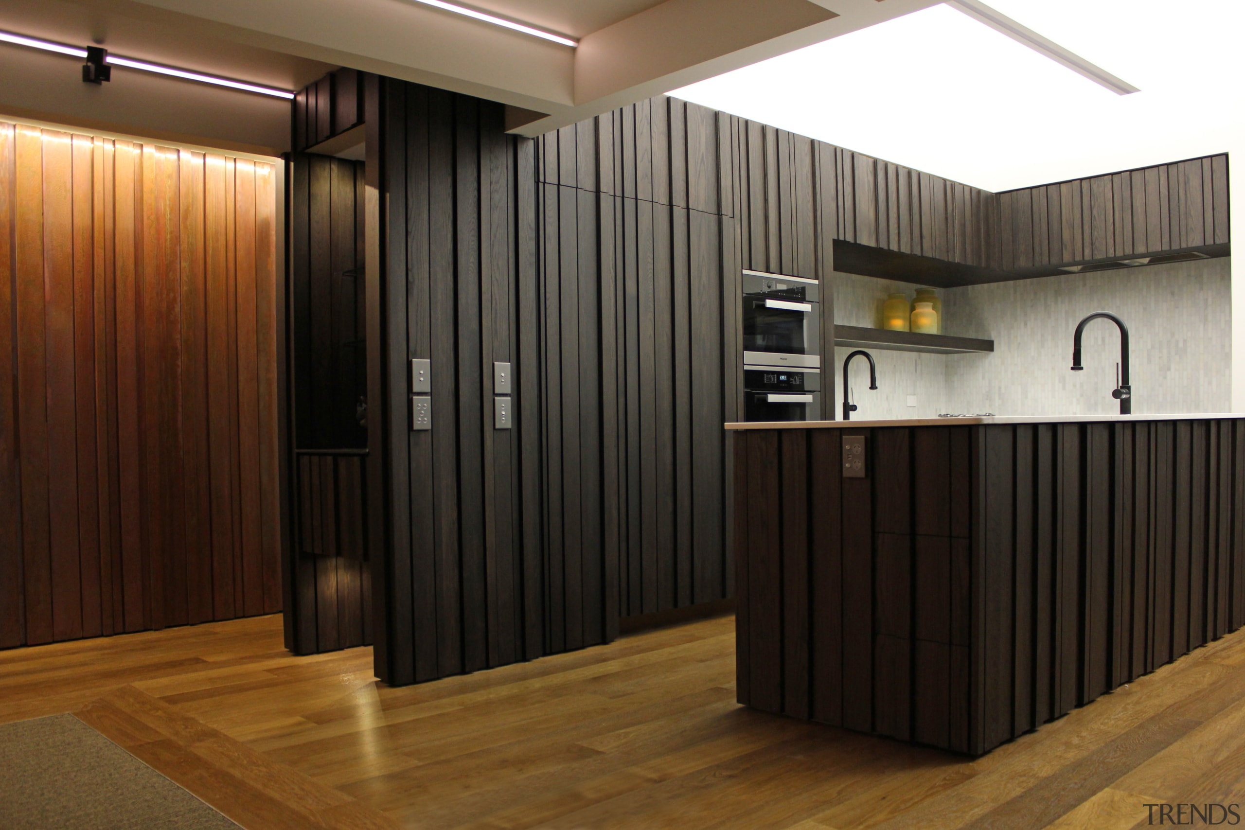 Dark-stained American oak cabinets with a custom profile floor, flooring, interior design, lobby, wood, black, brown