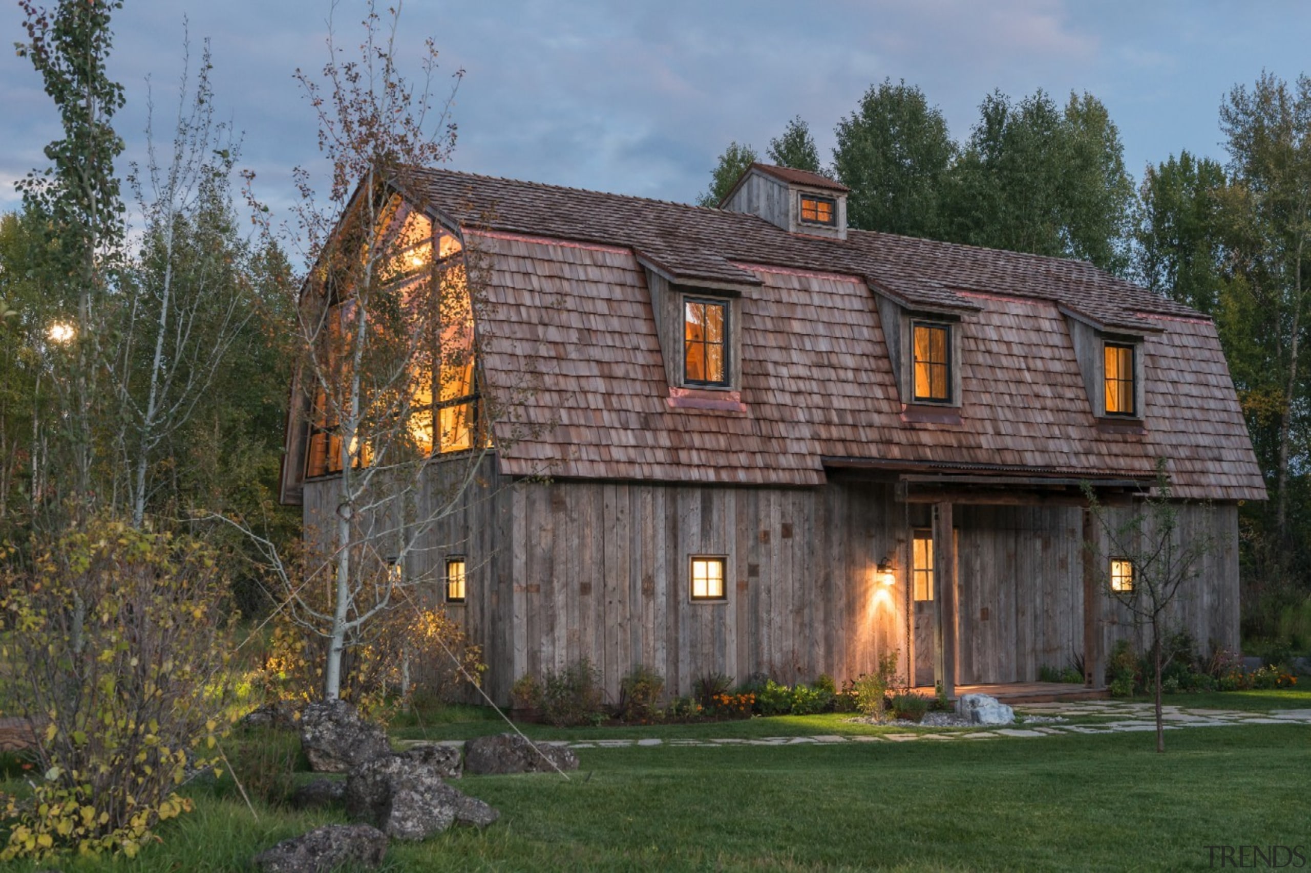 The contemporary additions manage to blend seamlessly with barn, building, cottage, estate, facade, farmhouse, home, house, log cabin, property, real estate, shed, siding