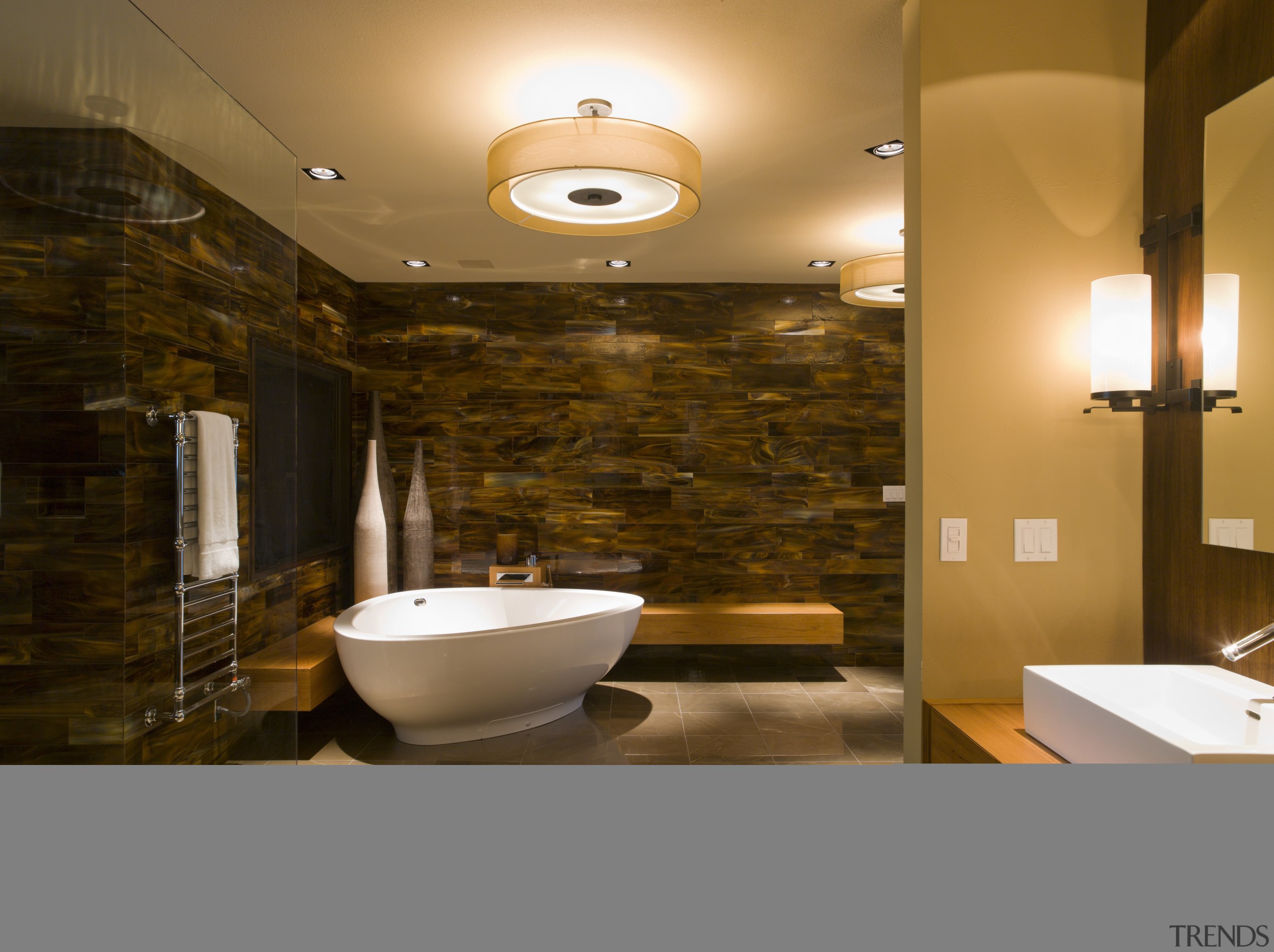 This remodeled bathroom features dramatic tortoiseshell glass wall architecture, bathroom, ceiling, interior design, lighting, room, wall, brown