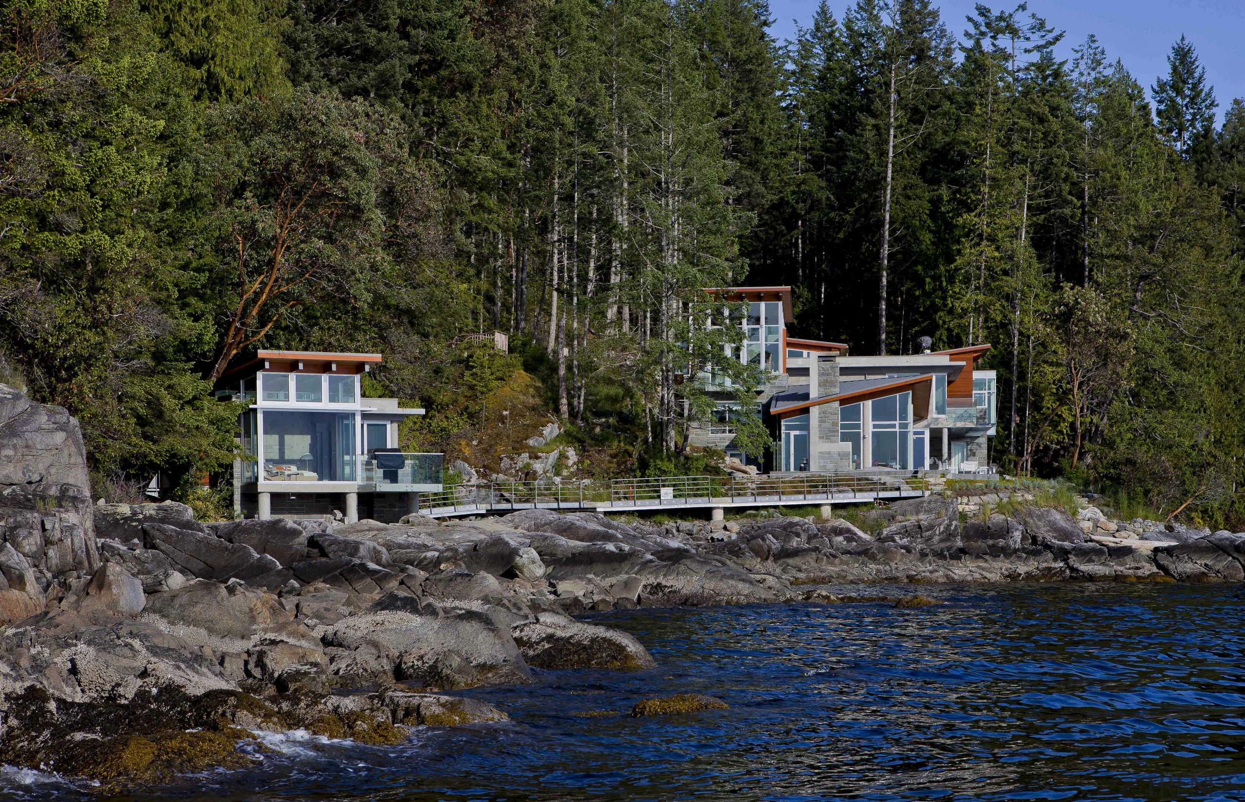 Exterior view of waterfront home. - Exterior view bay, body of water, coast, cottage, home, house, inlet, lake, real estate, reflection, river, shore, sky, tree, water, brown, black