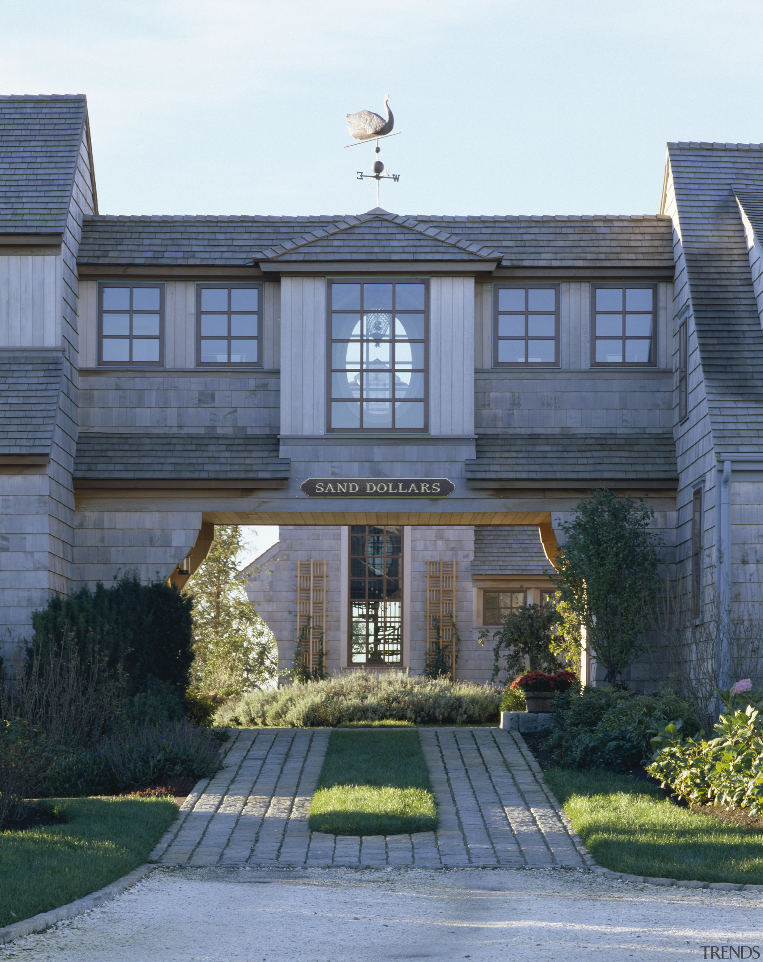 Exterior view of an enclosed bridge with shingle architecture, building, cottage, estate, facade, home, house, mansion, neighbourhood, property, real estate, residential area, suburb, window, teal