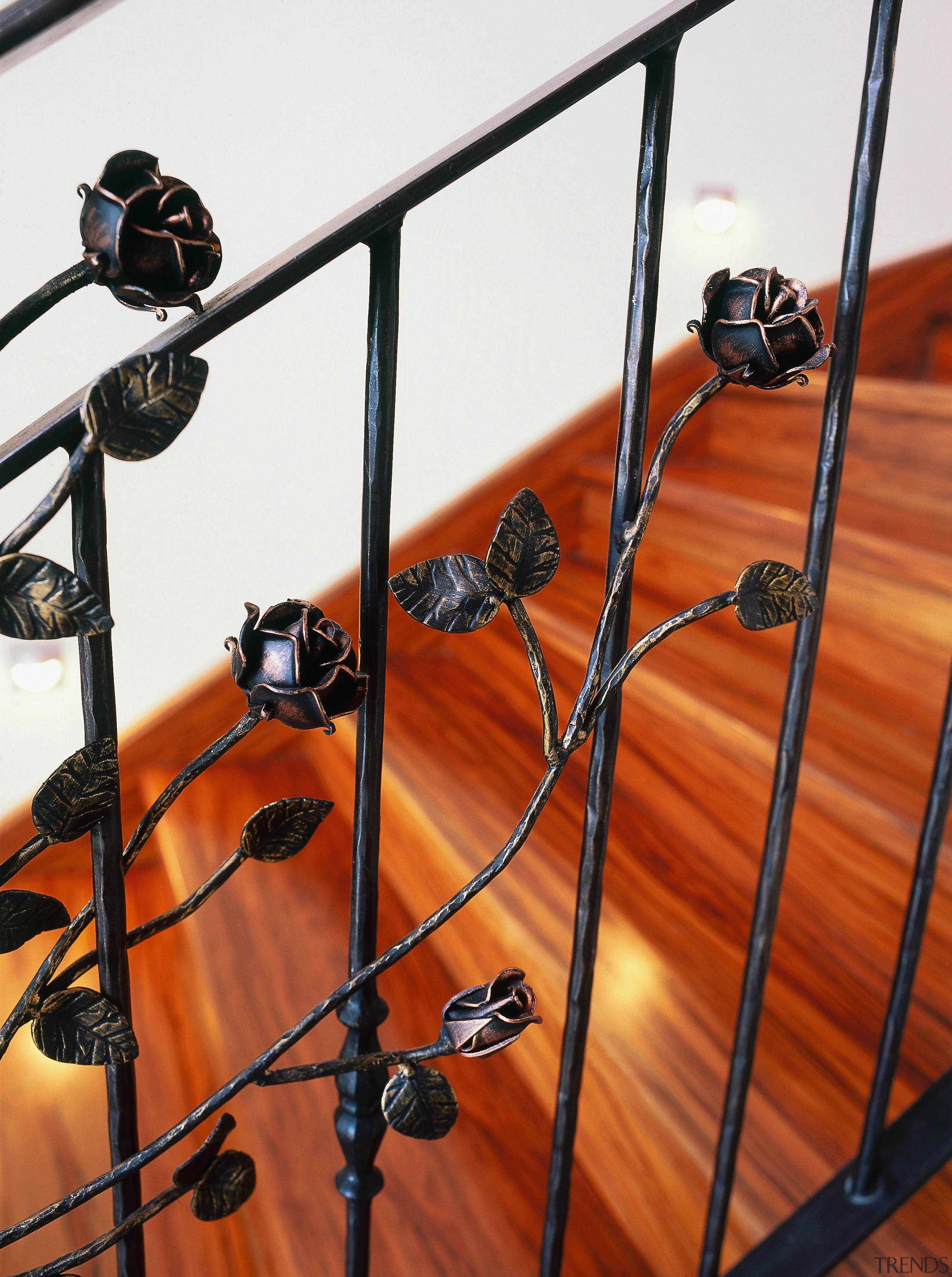 Timber staircase with ornate steel balustrading. - Timber iron, material, metal, wood, red, white