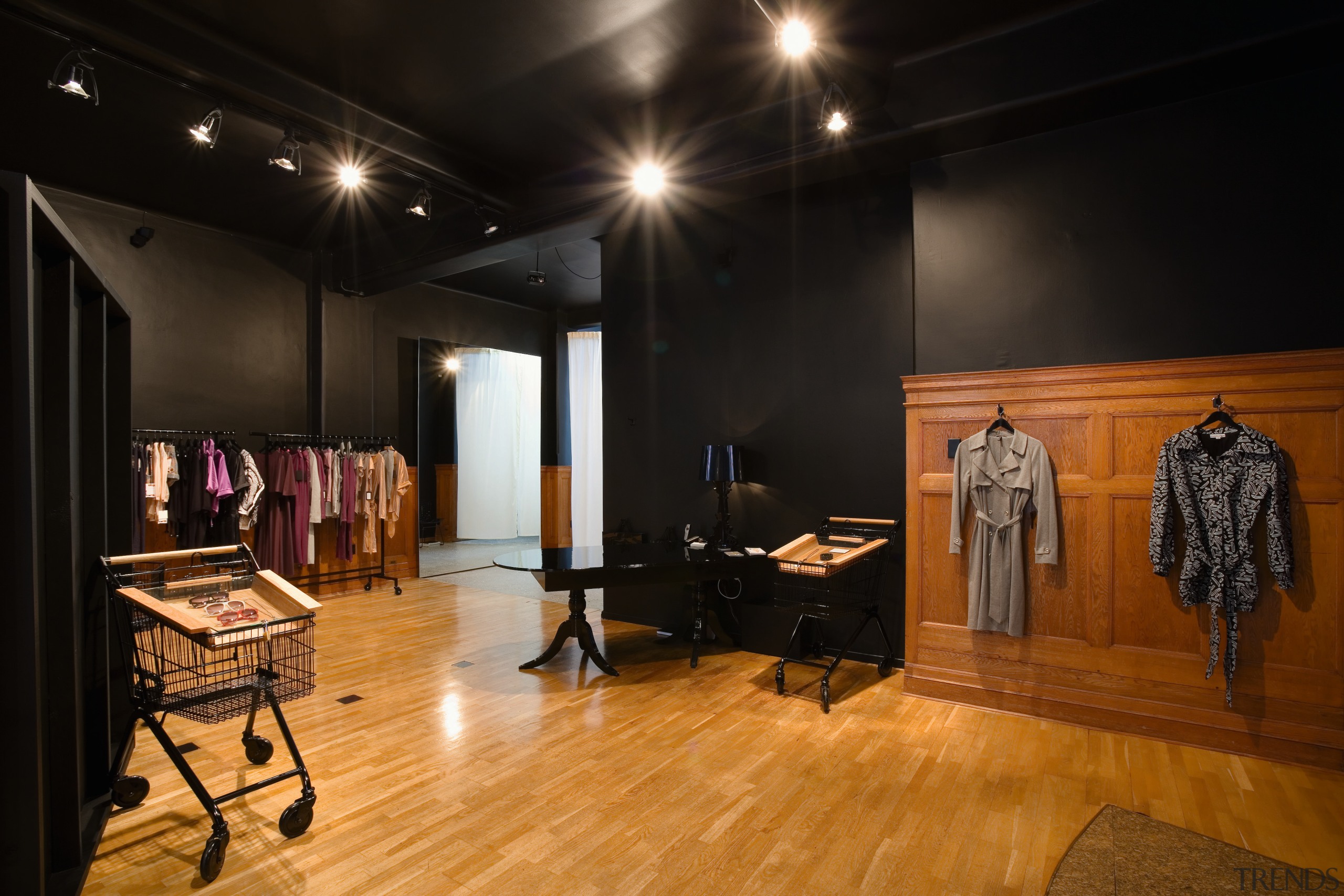 A view of a retail store. - A boutique, ceiling, floor, flooring, interior design, wood flooring, black