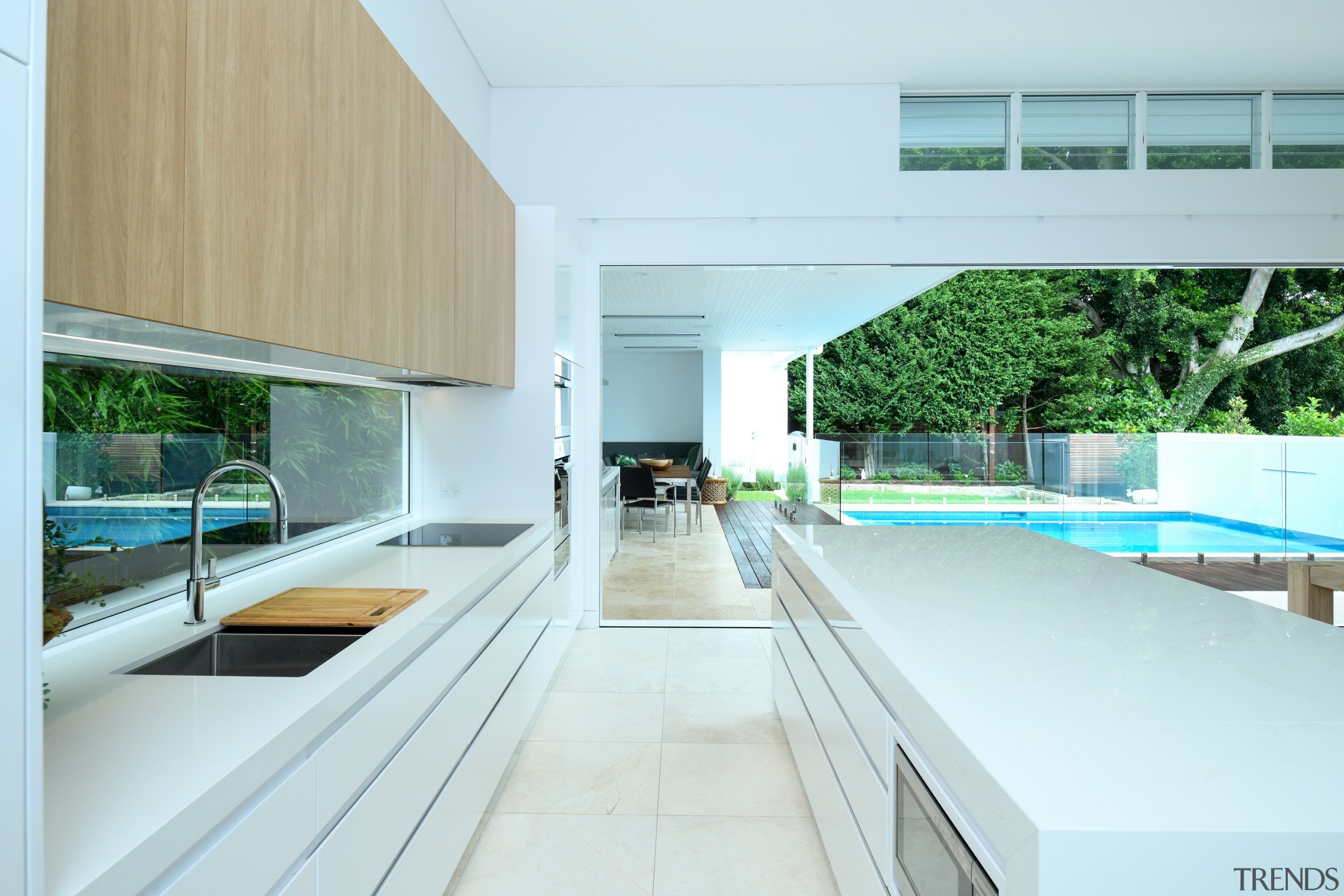 There's a seamless transition between the external entertaining apartment, architecture, building, ceiling, daylighting, design, floor, furniture, home, house, interior design, property, real estate, room, window, white