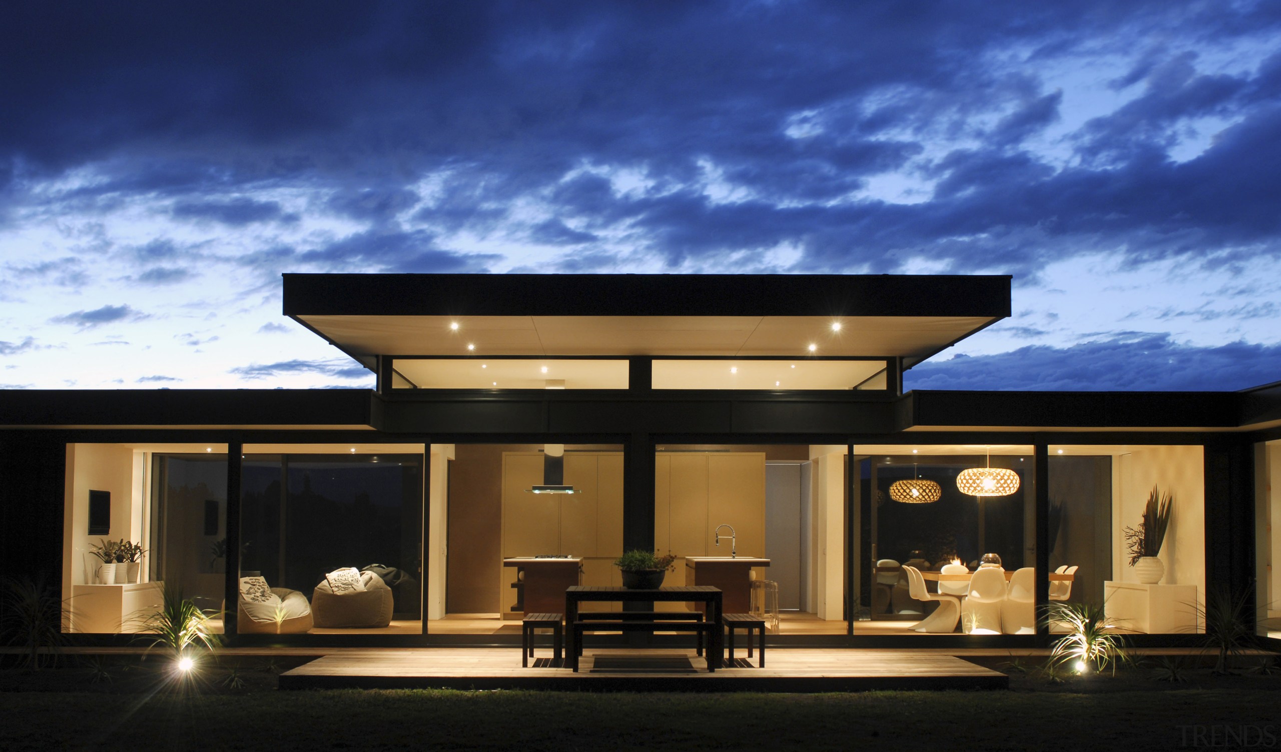 Exterior view of house featuring cladding, roofing, landscaping. architecture, estate, home, house, lighting, property, real estate, roof, sky, black