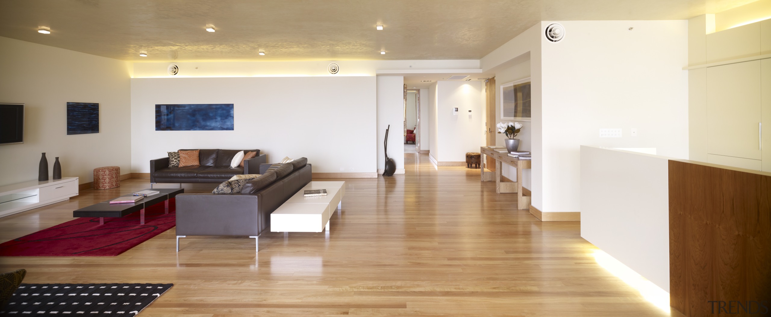 View of apartment living area in a restored ceiling, floor, flooring, hardwood, interior design, living room, loft, property, real estate, room, wood, wood flooring, white, orange