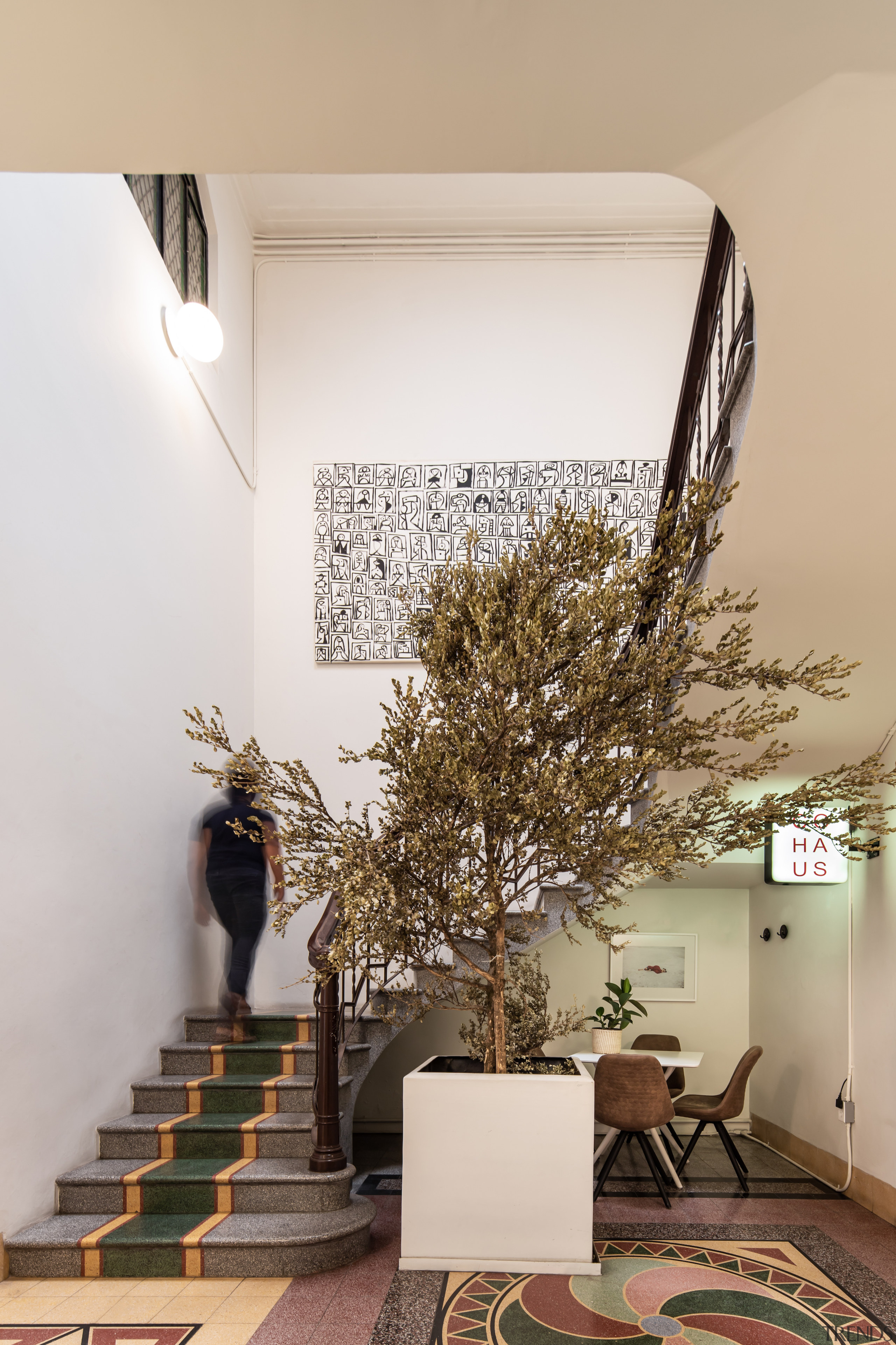 The original stairs and dramatic character tile floors. 