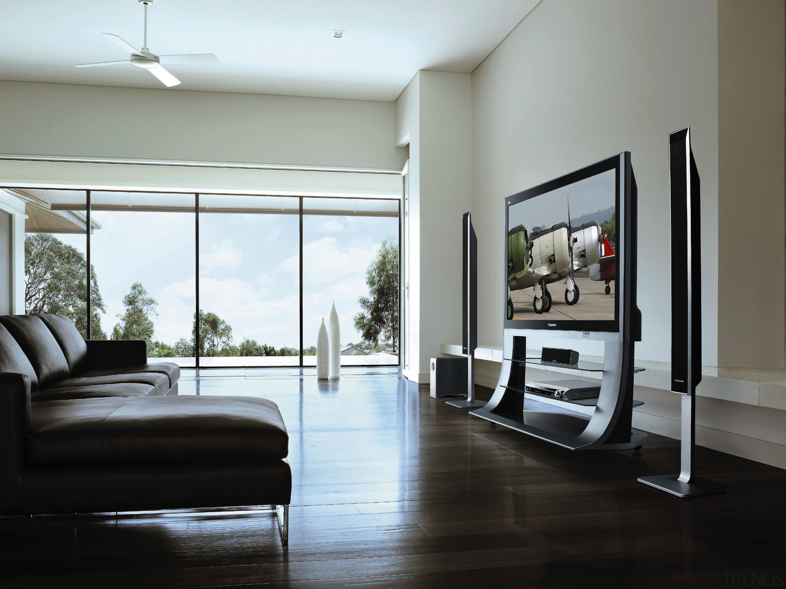 View of lounge room with home theatre systems, door, floor, flooring, furniture, home, interior design, living room, real estate, room, table, window, gray, black, white