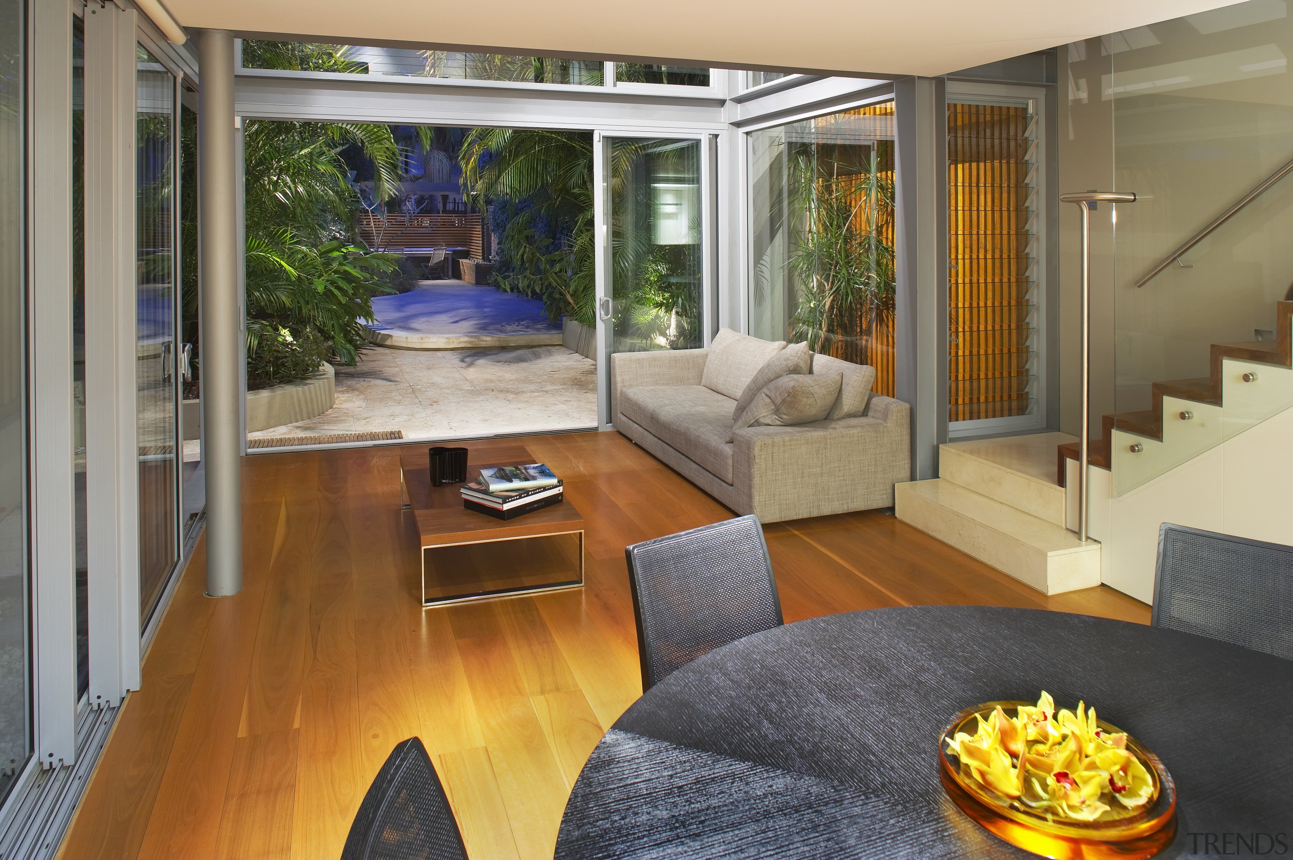 A glazed, three-storey atrium fills this home with estate, home, house, interior design, living room, real estate, window, brown, gray