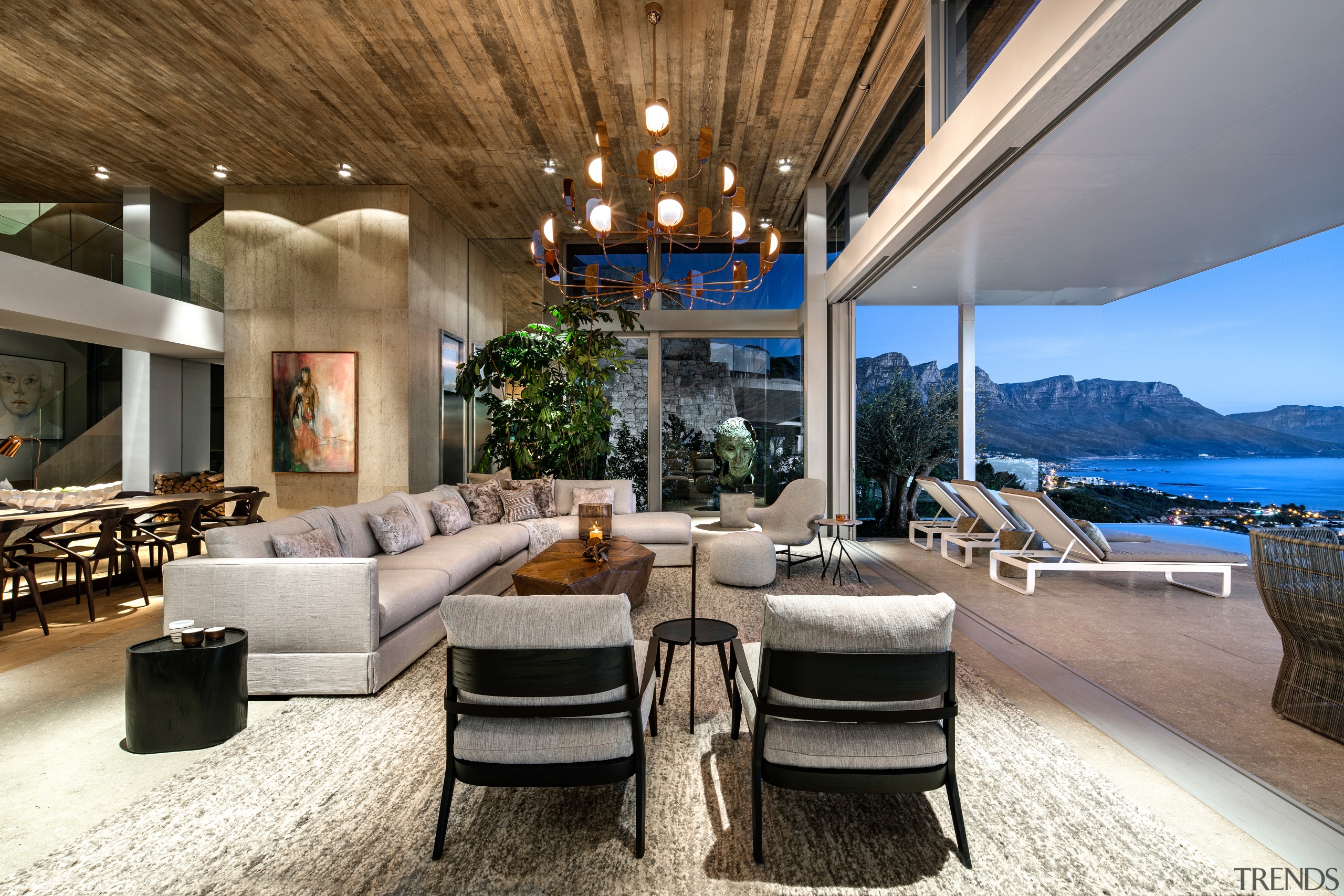 The site for this home by architects SAOTA apartment, architecture, building, ceiling, coffee table, condominium, design, estate, floor, furniture, home, house, interior design, living room, lobby, penthouse apartment, property, real estate, resort, room, sky, table, villa, brown