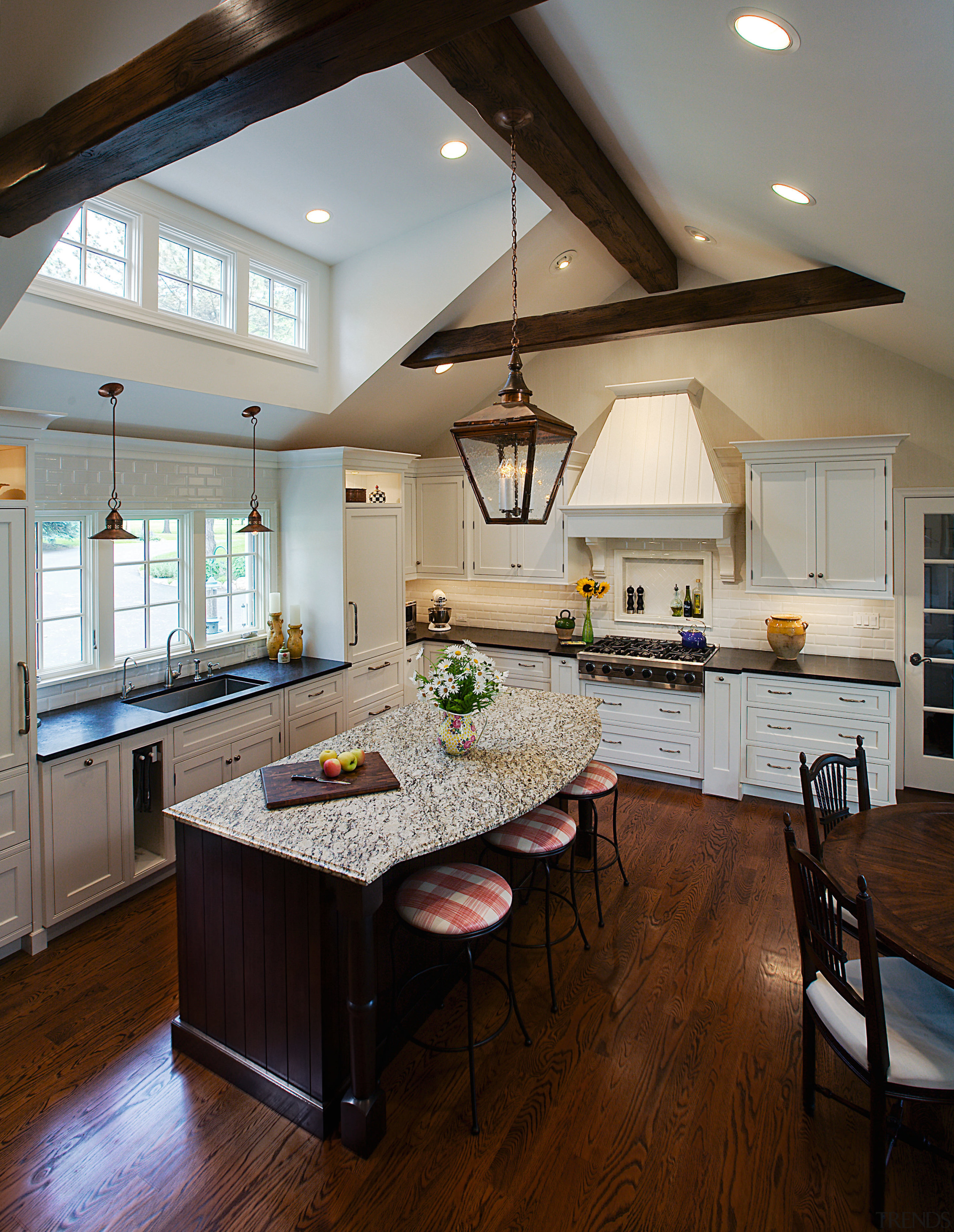 View of a kitchen designed by Drury Design cabinetry, ceiling, countertop, cuisine classique, daylighting, floor, flooring, hardwood, interior design, kitchen, laminate flooring, living room, room, window, wood flooring, gray, brown