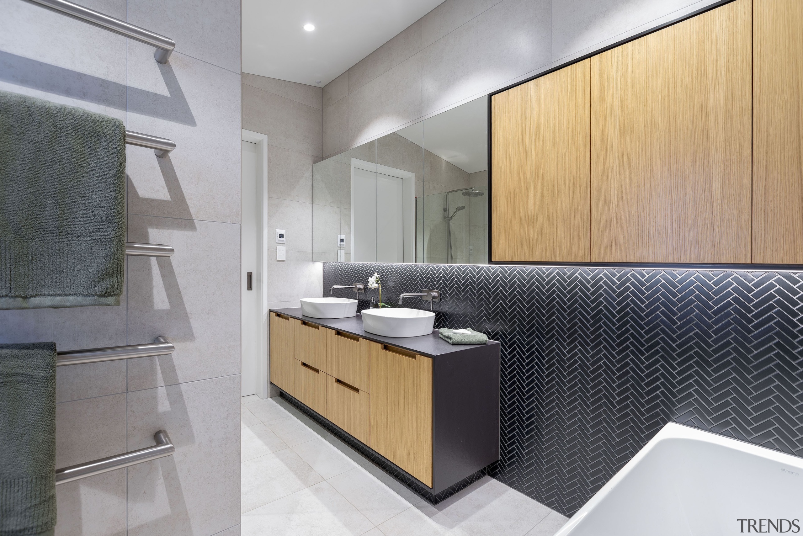 Push-to-open mirror-fronted cabinets optimise storage and light play. 