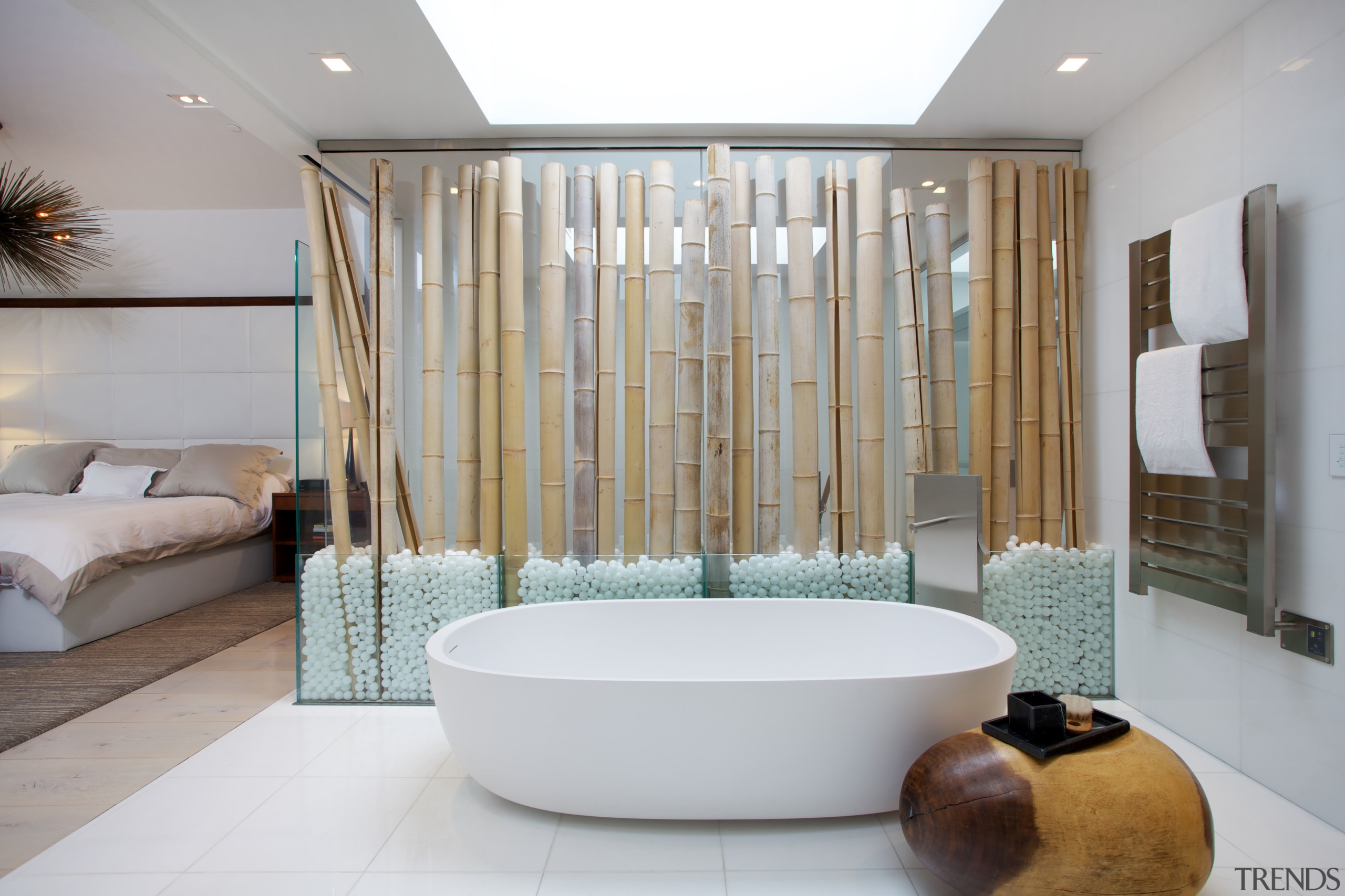 The glass wall with bamboo trunks screens the bathroom, bathtub, interior design, plumbing fixture, room, gray