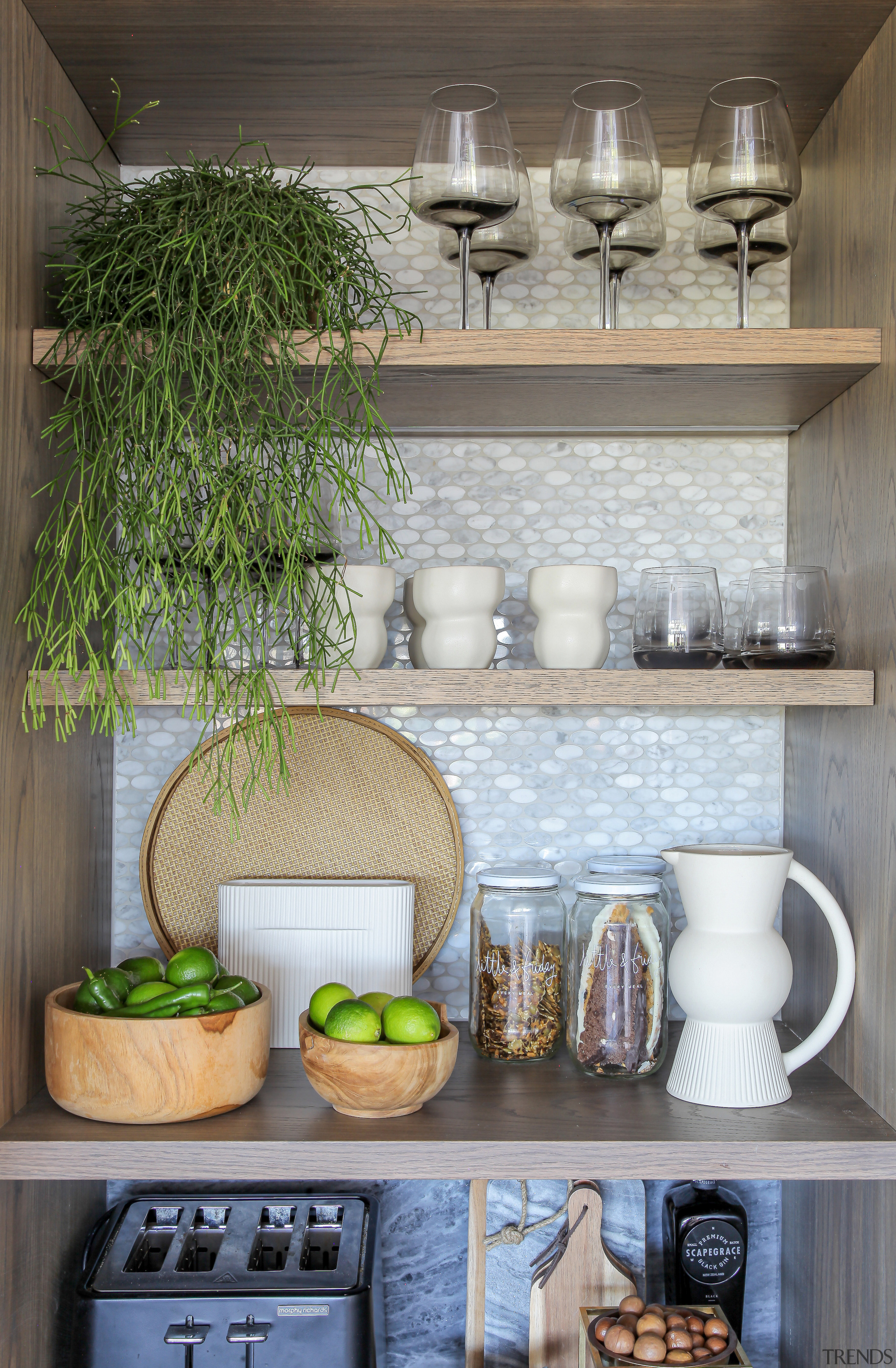 The appliance pantry interior also features refined finishes. 