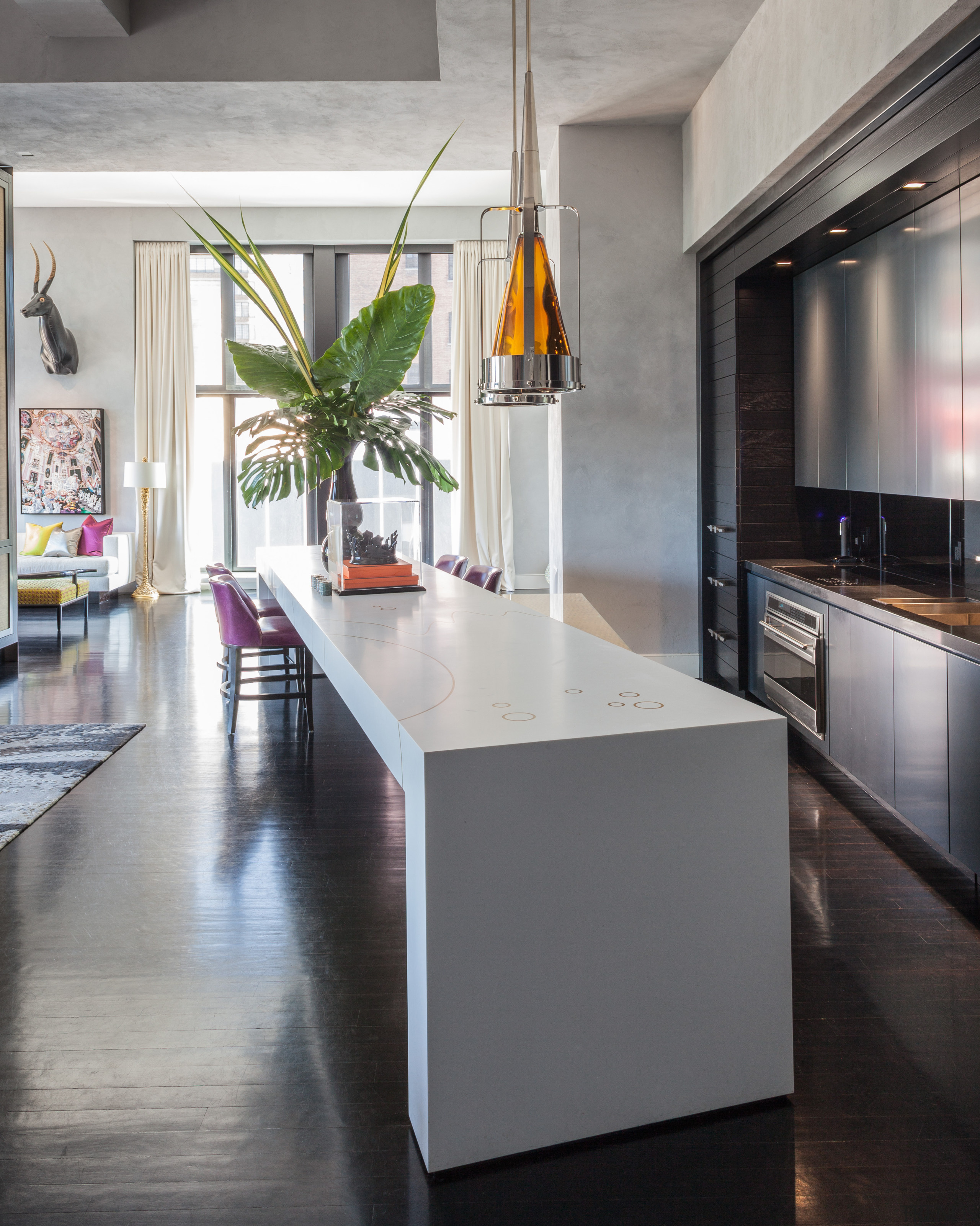 This Corian counter angles away from the kitchen, countertop, cuisine classique, floor, flooring, interior design, kitchen, loft, table, gray