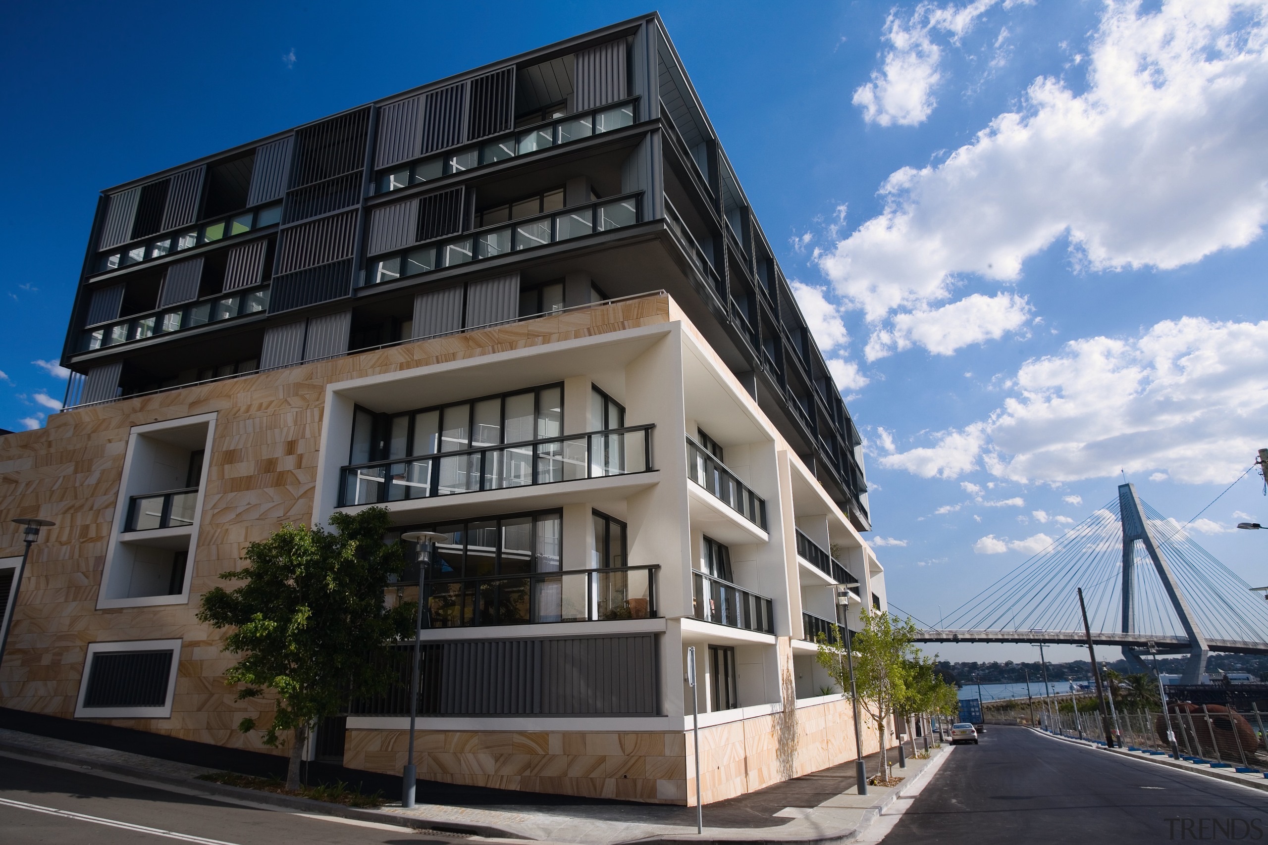An exterior view of the apartments. - An apartment, architecture, building, commercial building, condominium, corporate headquarters, facade, home, house, mixed use, neighbourhood, property, real estate, residential area, sky, black