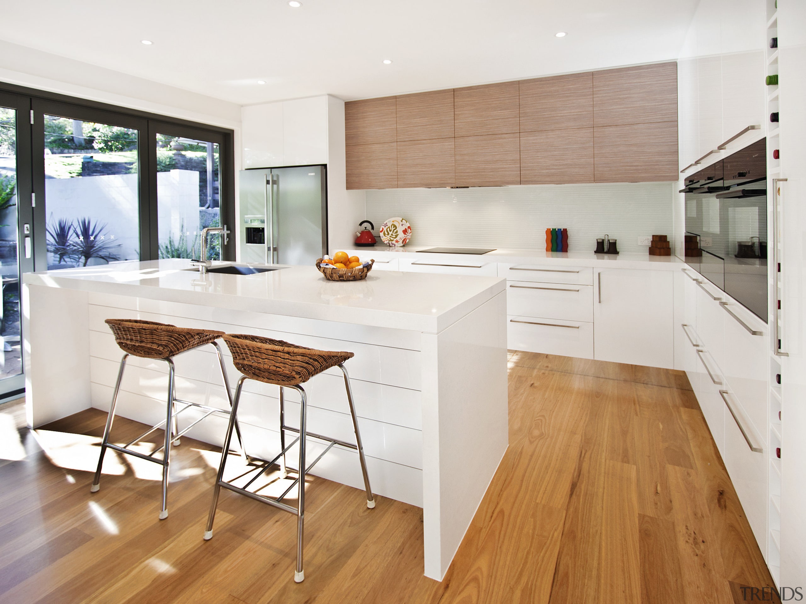 View of kitchen featuring wood floors, white bench cabinetry, countertop, cuisine classique, floor, flooring, hardwood, interior design, kitchen, laminate flooring, real estate, room, wood, wood flooring, white