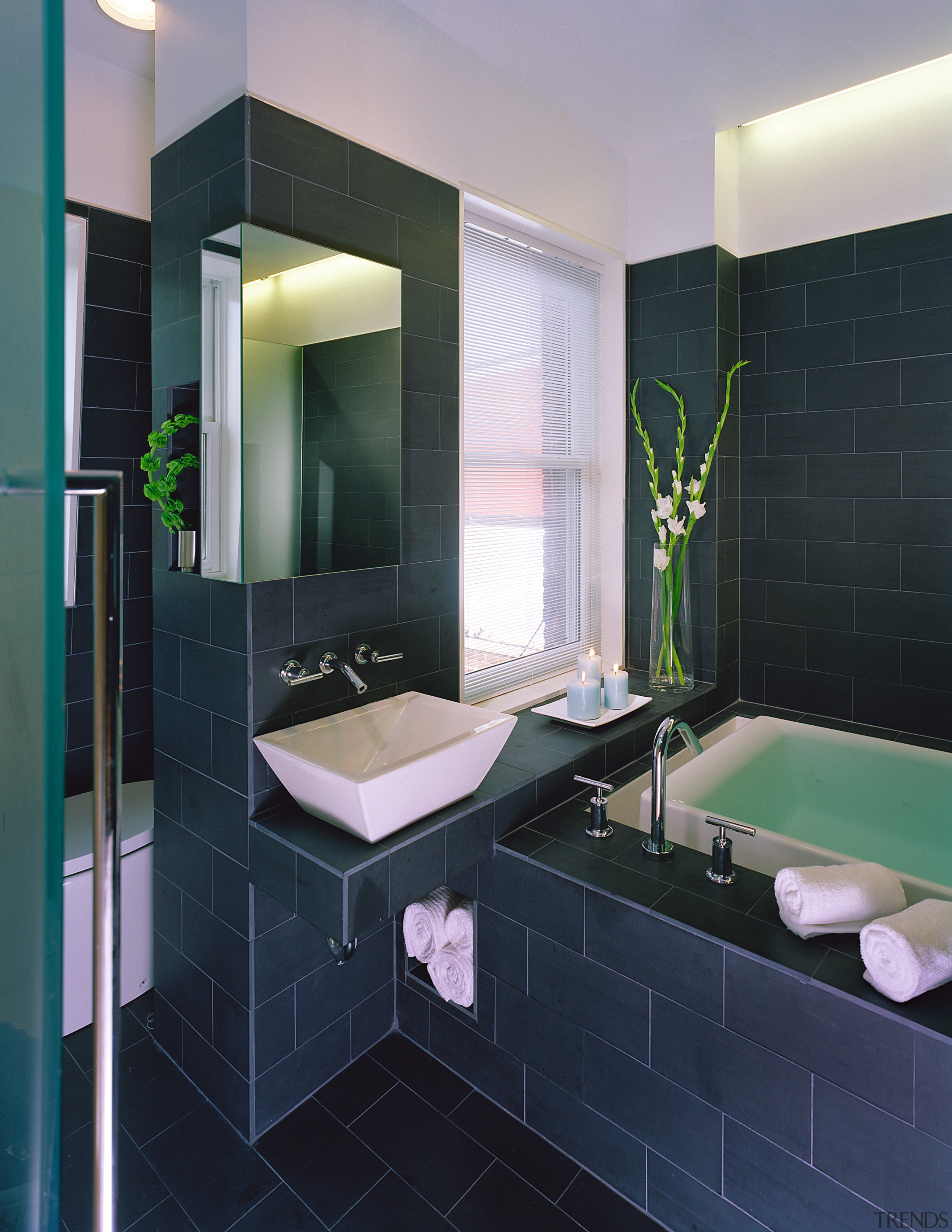 A view of the bathrrom, tiled floor and bathroom, floor, interior design, room, tile, black, gray