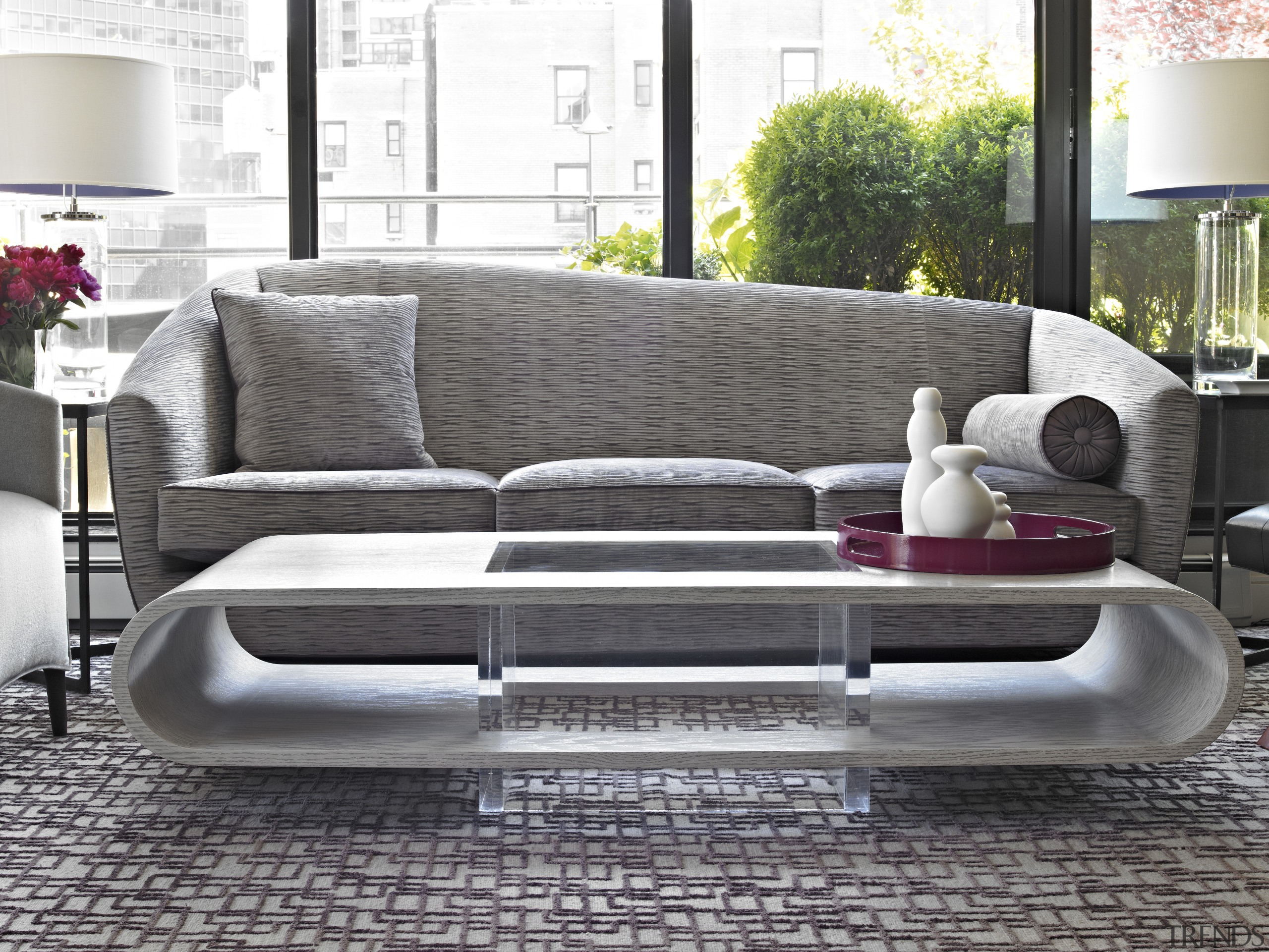 The asymmetrical sofa was custom designed by Coffinier angle, coffee table, couch, floor, flooring, furniture, interior design, living room, loveseat, product design, sofa bed, table, gray, white