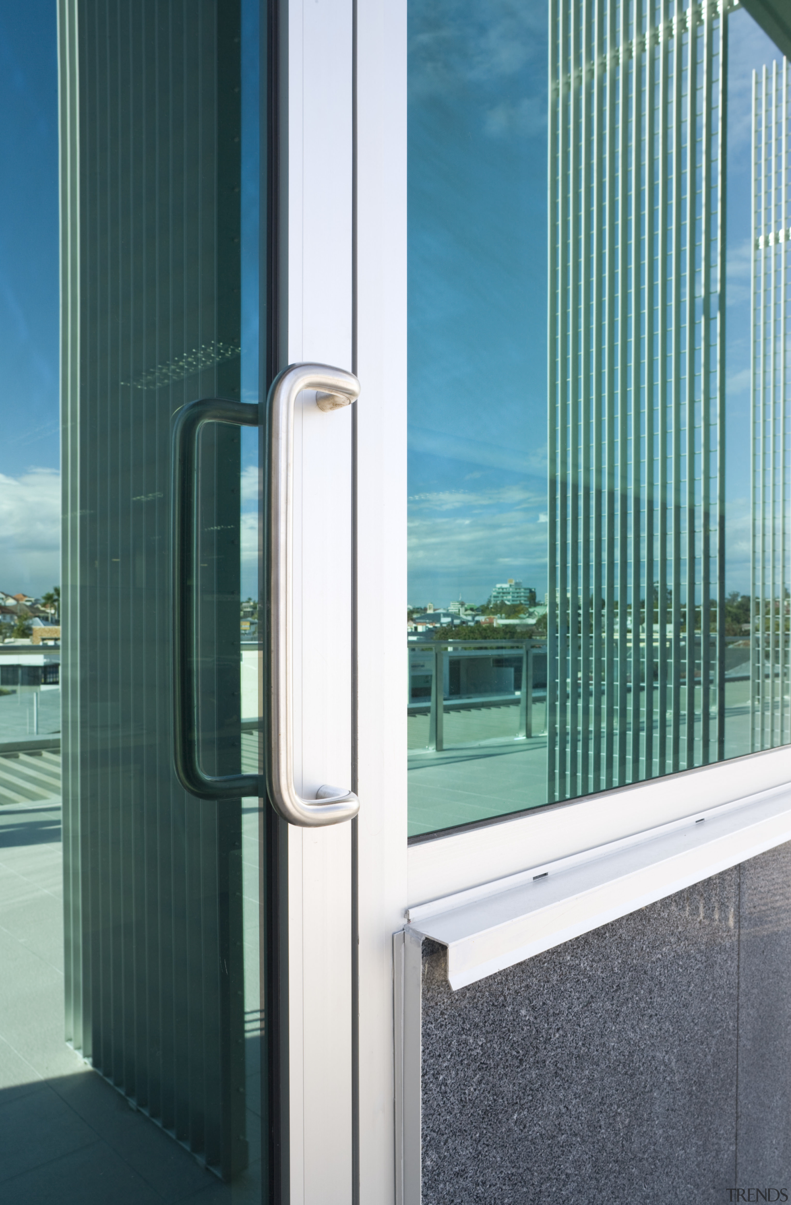 View of an office building featuring glazing which architecture, daylighting, door, glass, sky, window, teal