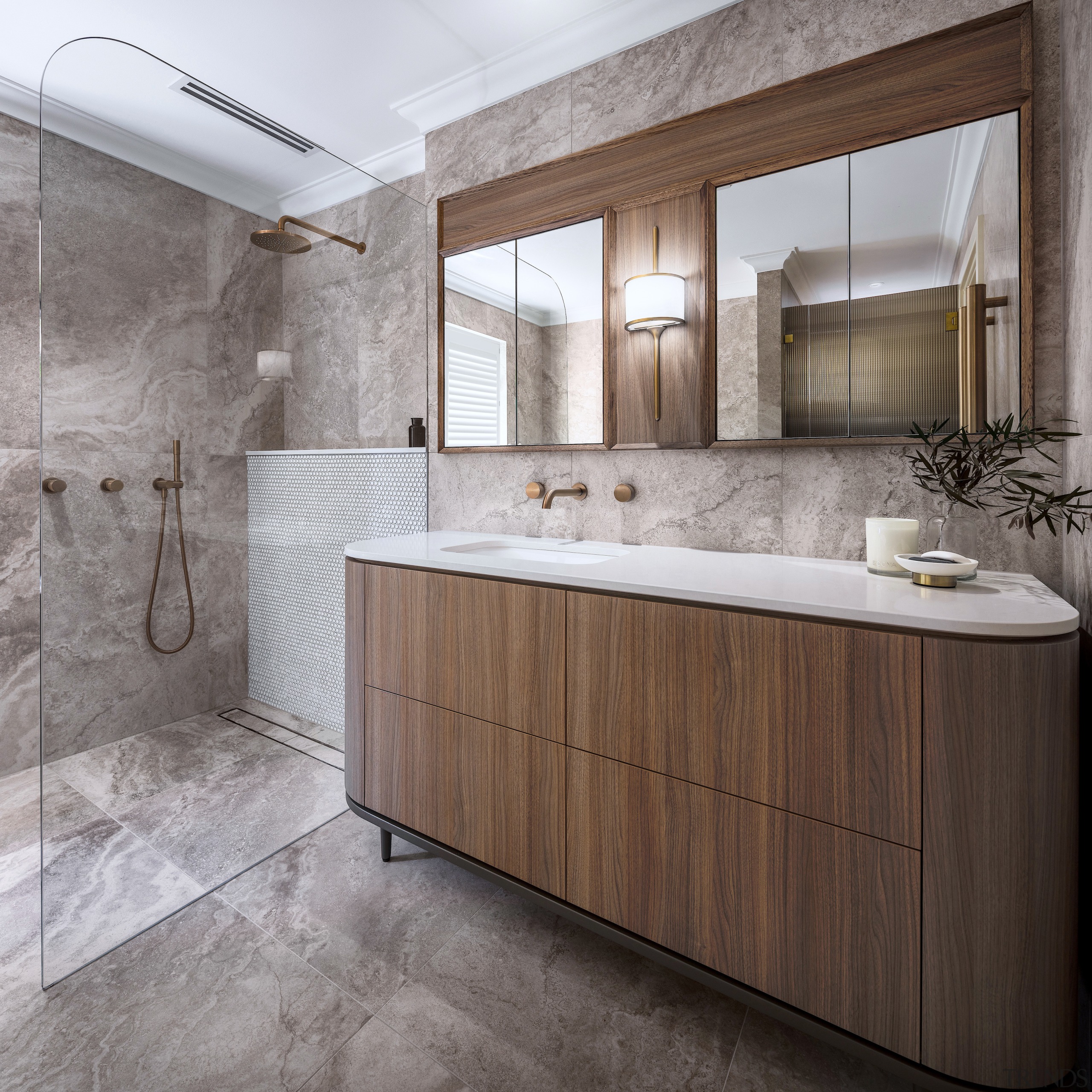 Stone-look porcelain tiles with mitreed exposed edges extend 