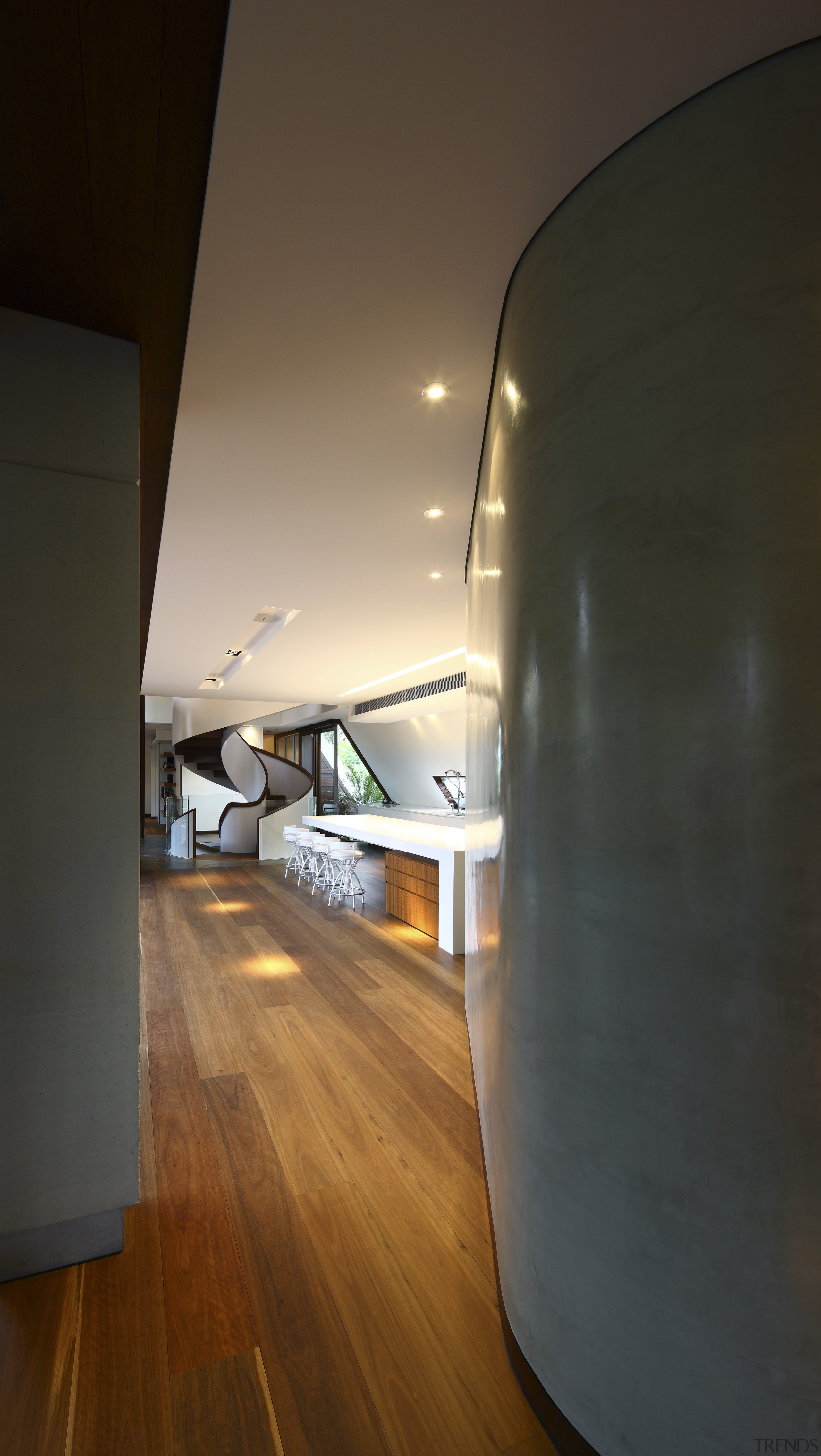 View of kitchen area featuring hardwood flooring, island architecture, ceiling, daylighting, floor, flooring, hardwood, home, house, interior design, laminate flooring, light, light fixture, lighting, wall, wood, wood flooring, black, brown