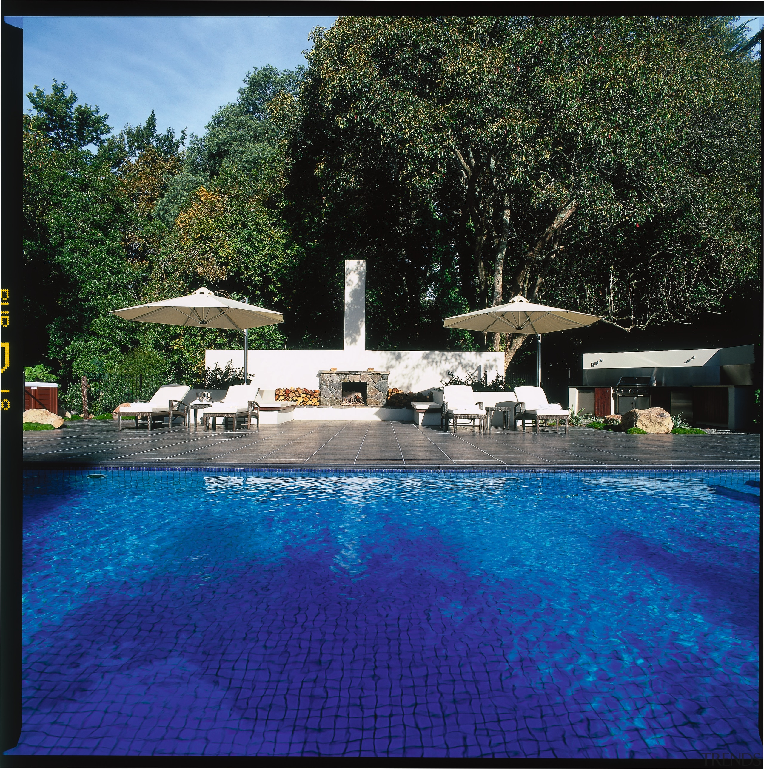 View of the poolside living area - View backyard, estate, home, house, leisure, lighting, property, real estate, reflection, resort, resort town, sky, swimming pool, villa, water, water feature, blue, black