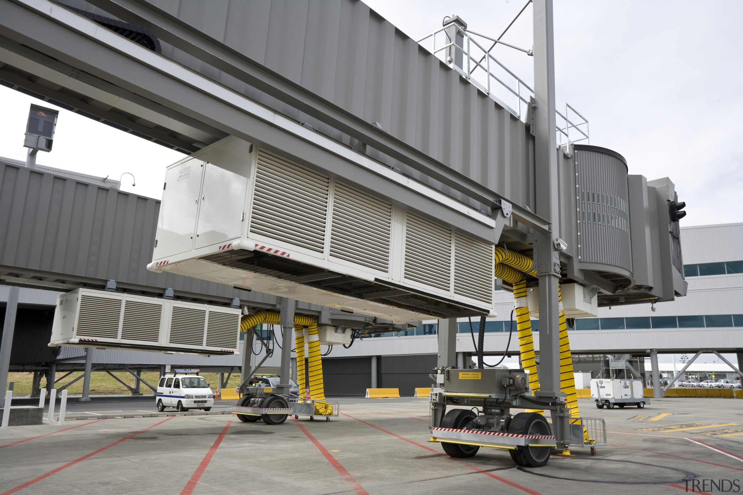 Images of the outside of Auckland International Airport airport, airport terminal, building, jet bridge, metropolitan area, transport, gray, white