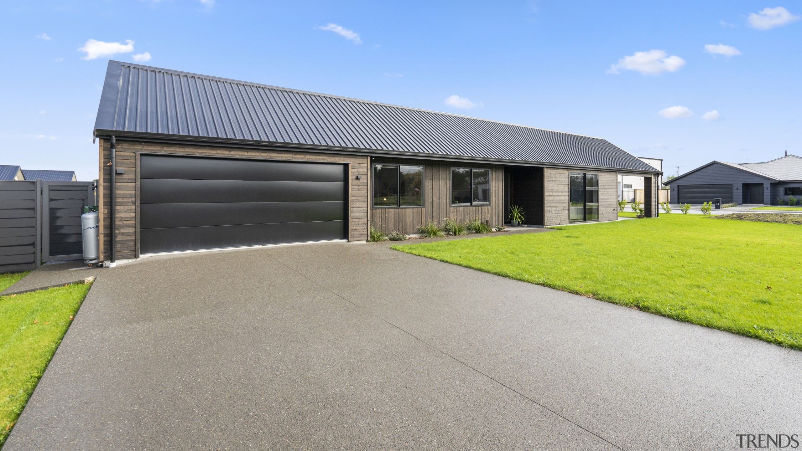 The double garage door provides subtle contrast to 