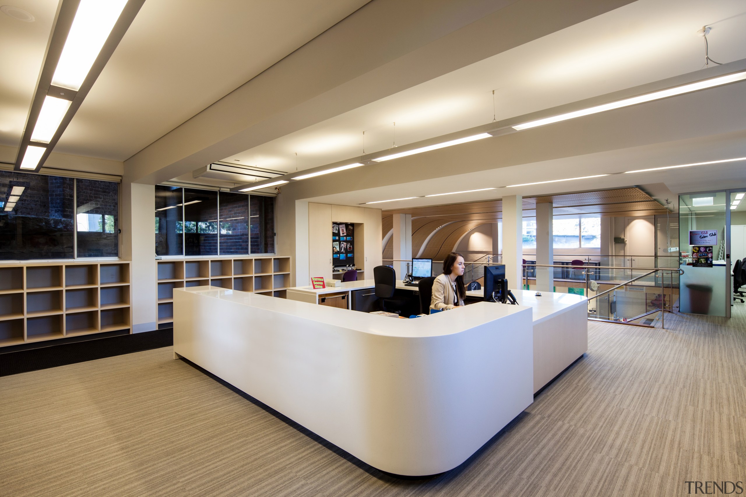 Reception area in the new mixed-media library facility ceiling, floor, flooring, institution, interior design, lobby, office, gray, brown