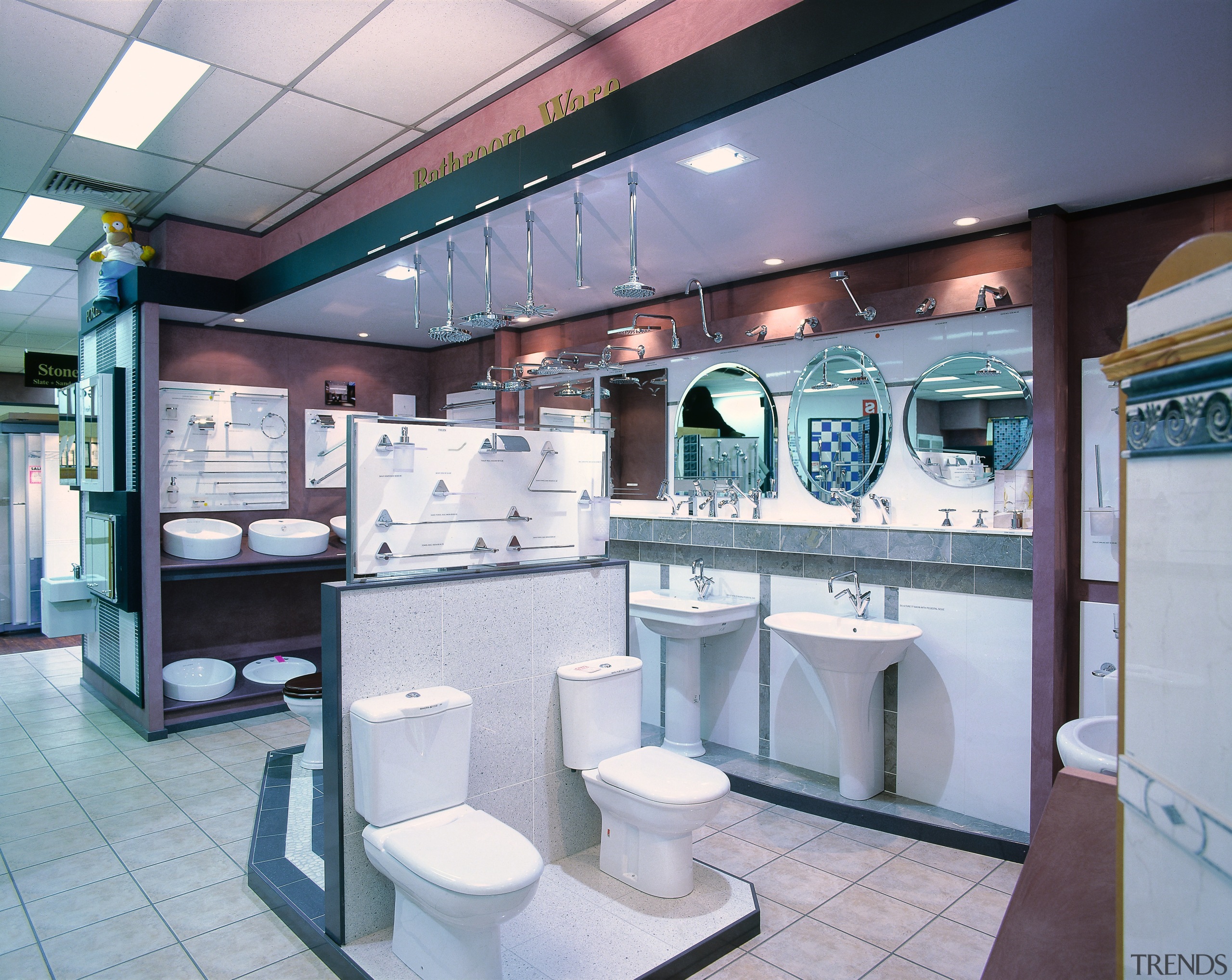 A viewof a bathroom showroom, wtiled walls and interior design, gray