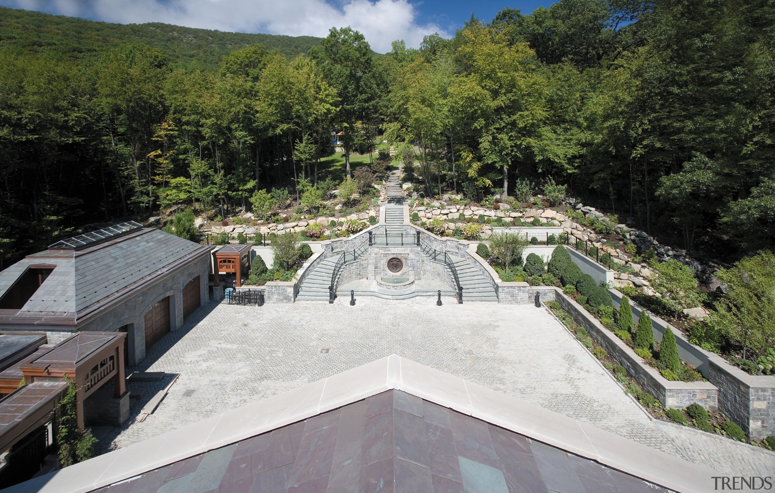 Exterior view of the landscaped gardens and pavings, tree