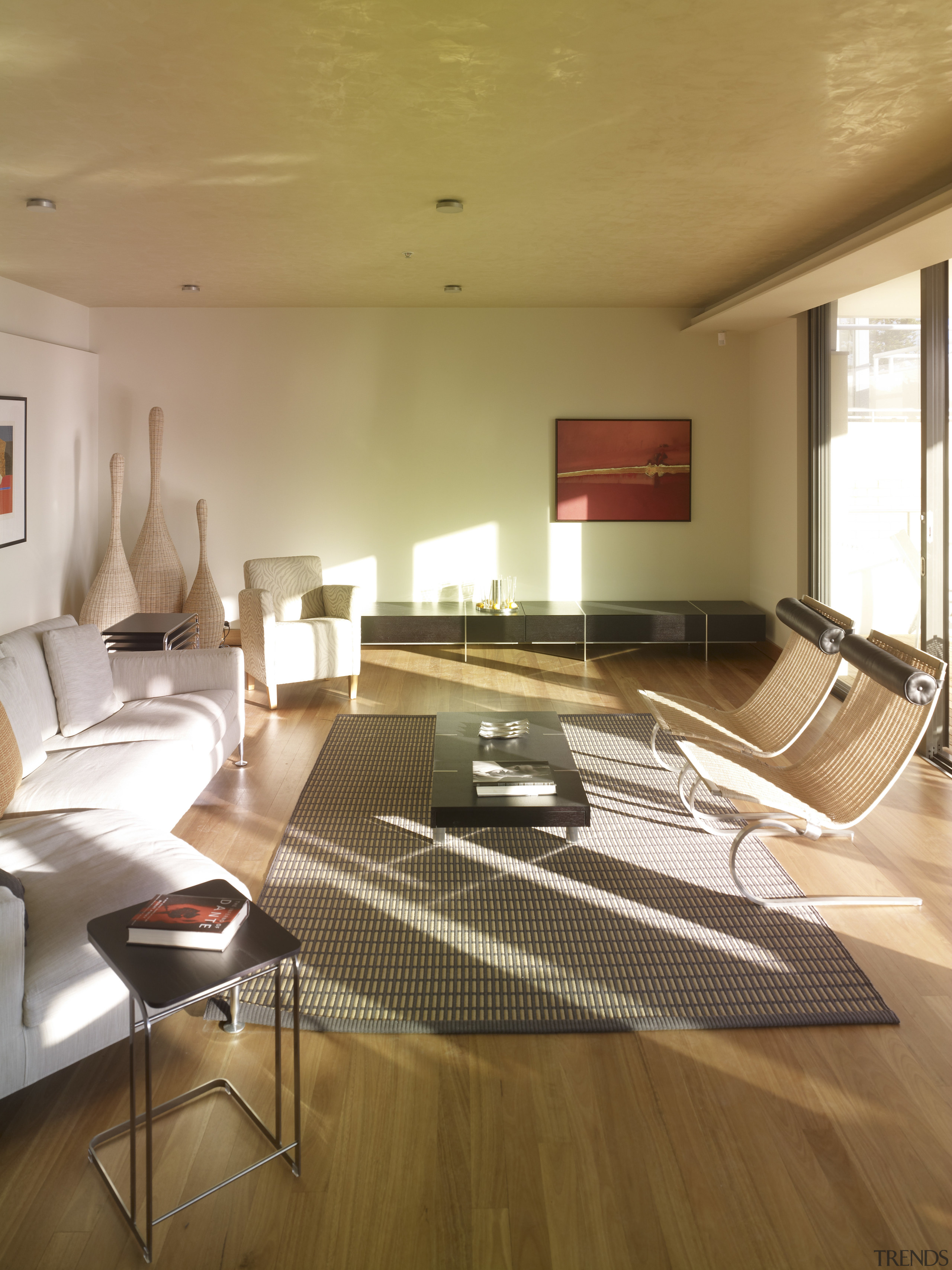 View of apartment living area in a restored architecture, ceiling, daylighting, floor, flooring, furniture, hardwood, house, interior design, living room, real estate, room, table, wood, wood flooring, brown, orange