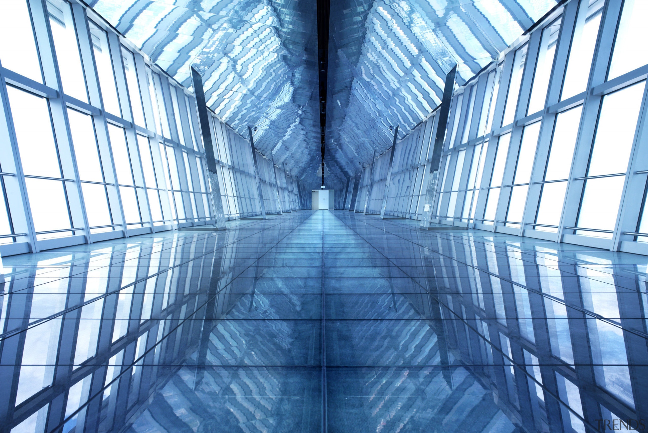 Interior view of the sky bridge which has architecture, blue, building, daylighting, daytime, energy, line, sky, skyscraper, structure, symmetry, teal, blue