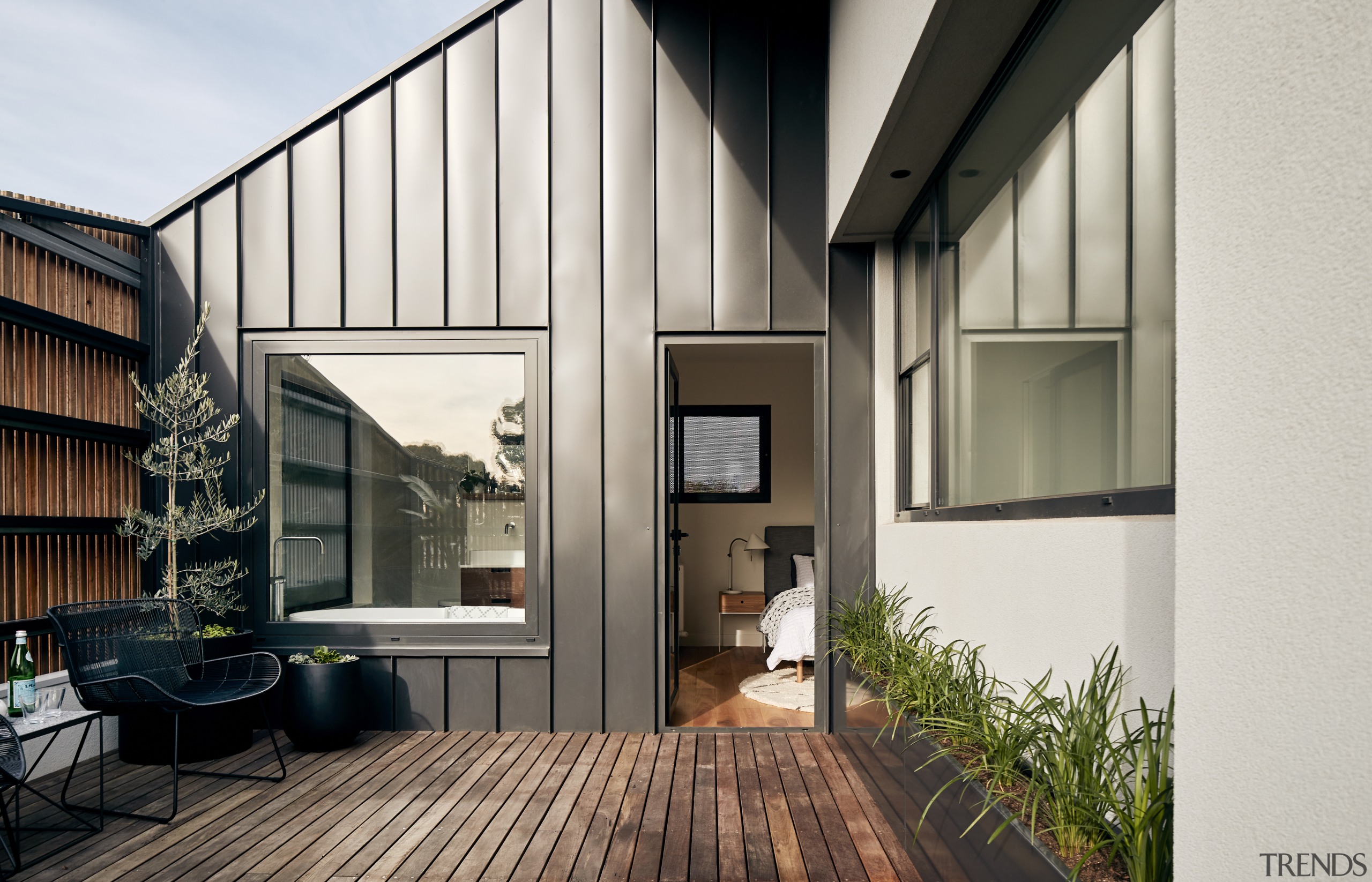 The lines of the standing seam cladding work apartment, architecture, building, ceiling, courtyard, daylighting, facade, floor, hardwood, home, house, interior design, loft, property, real estate, residential area, roof, room, siding, wall, window, wood, white, black