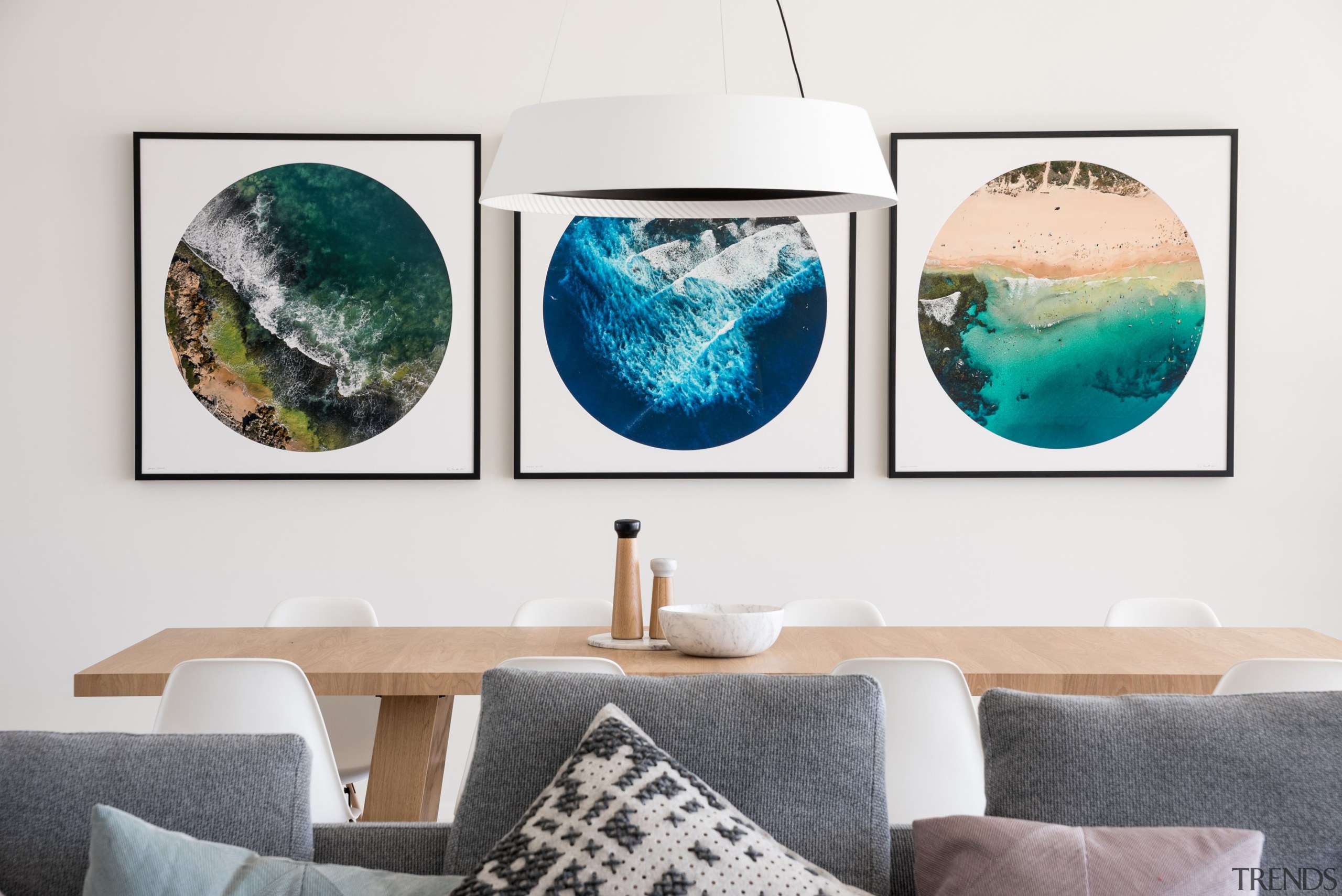 Selected artworks provide splashes of colour within the aqua, art, design, furniture, interior design, living room, modern art, room, space, table, teal, turquoise, wall, white