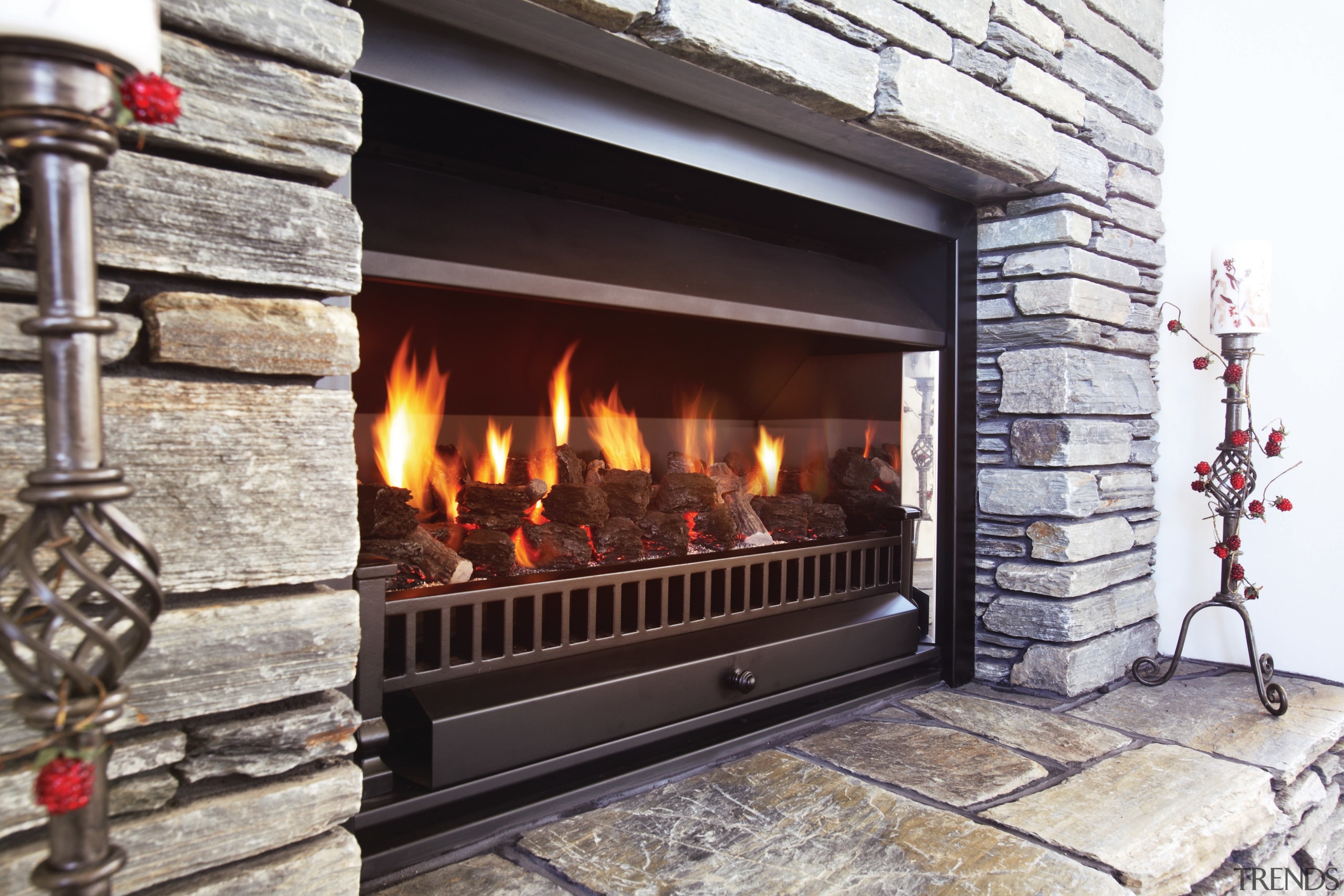 A view of a fireplace from Real Fires. fire screen, fireplace, hearth, heat, wood burning stove, gray, black