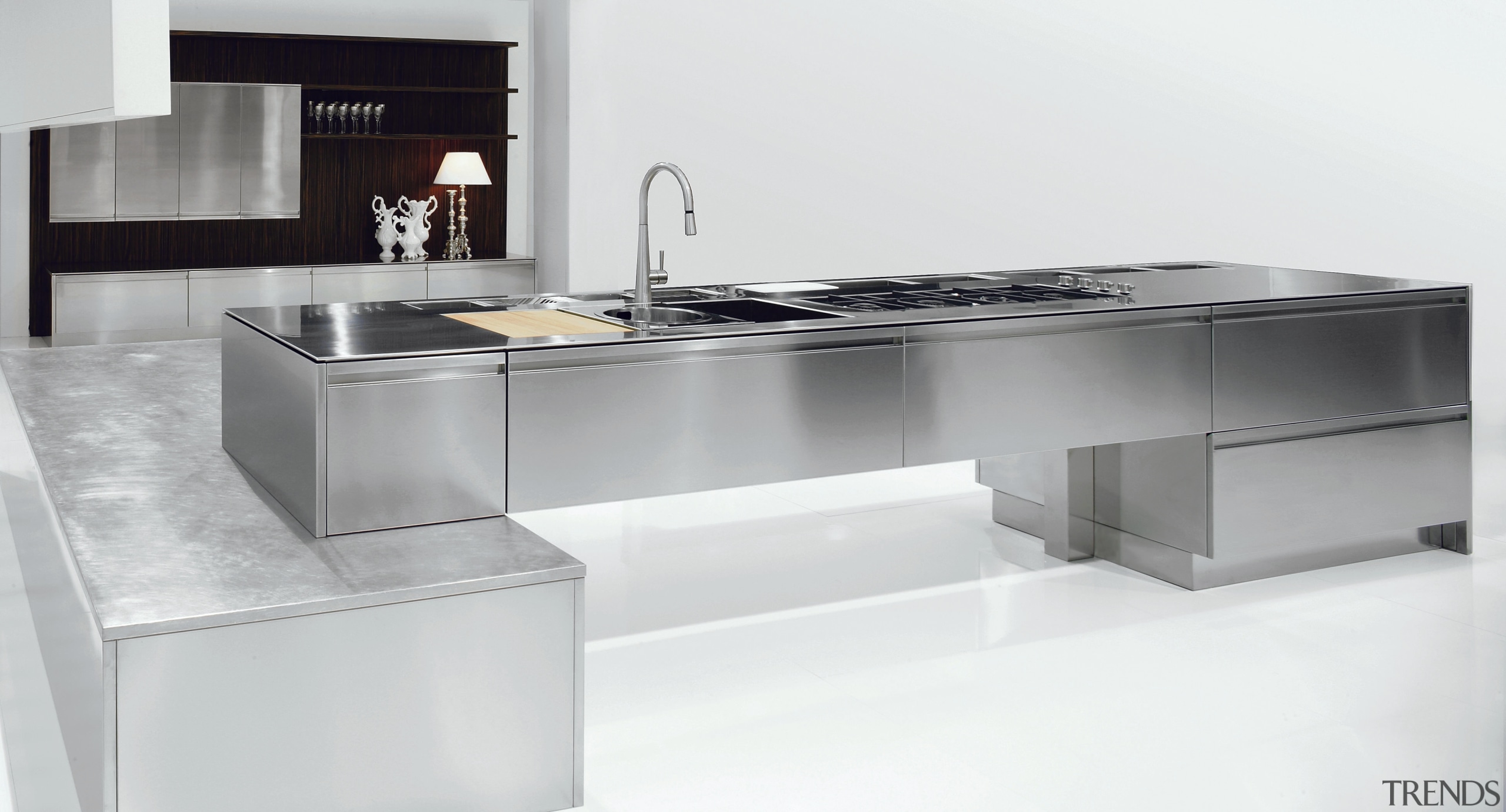 Kitchen with stainless steel countertop and cabinetry. countertop, desk, furniture, kitchen, product, product design, sink, table, tap, white