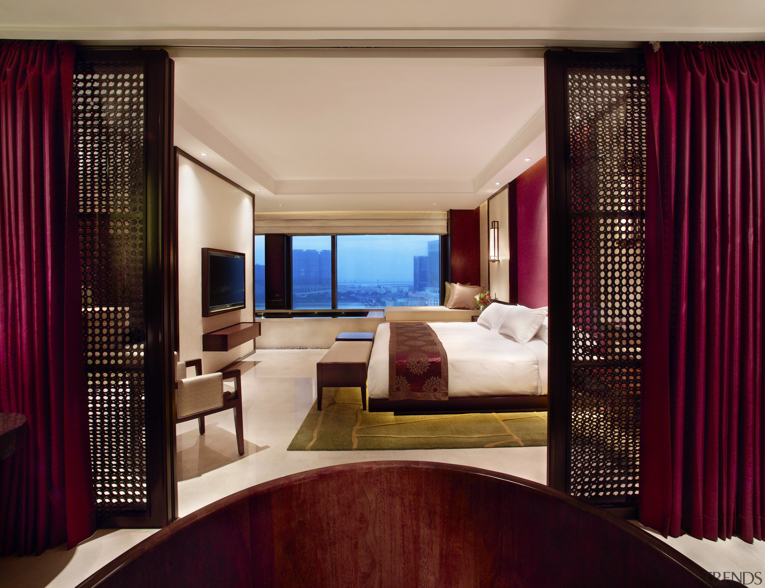 Bedroom as seen through doors, with white bed bedroom, curtain, estate, hotel, interior design, real estate, room, suite, window, window covering, window treatment, red, orange