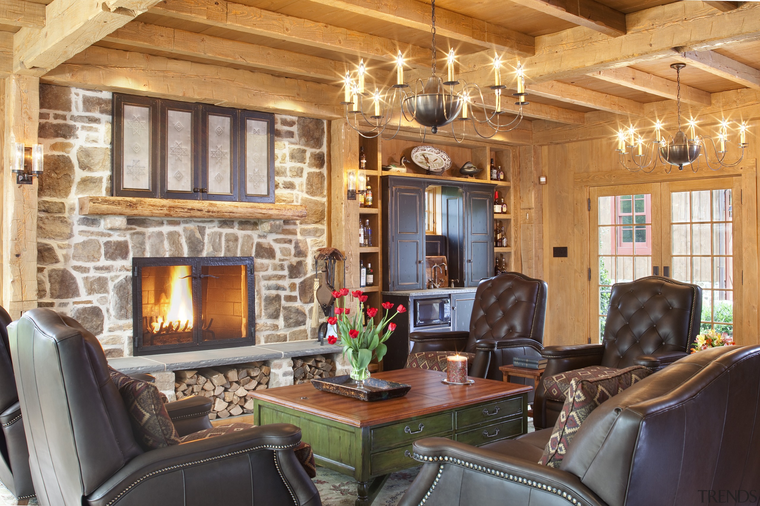 View of sitting area with stone fireplace and ceiling, home, interior design, living room, real estate, room, wood, orange