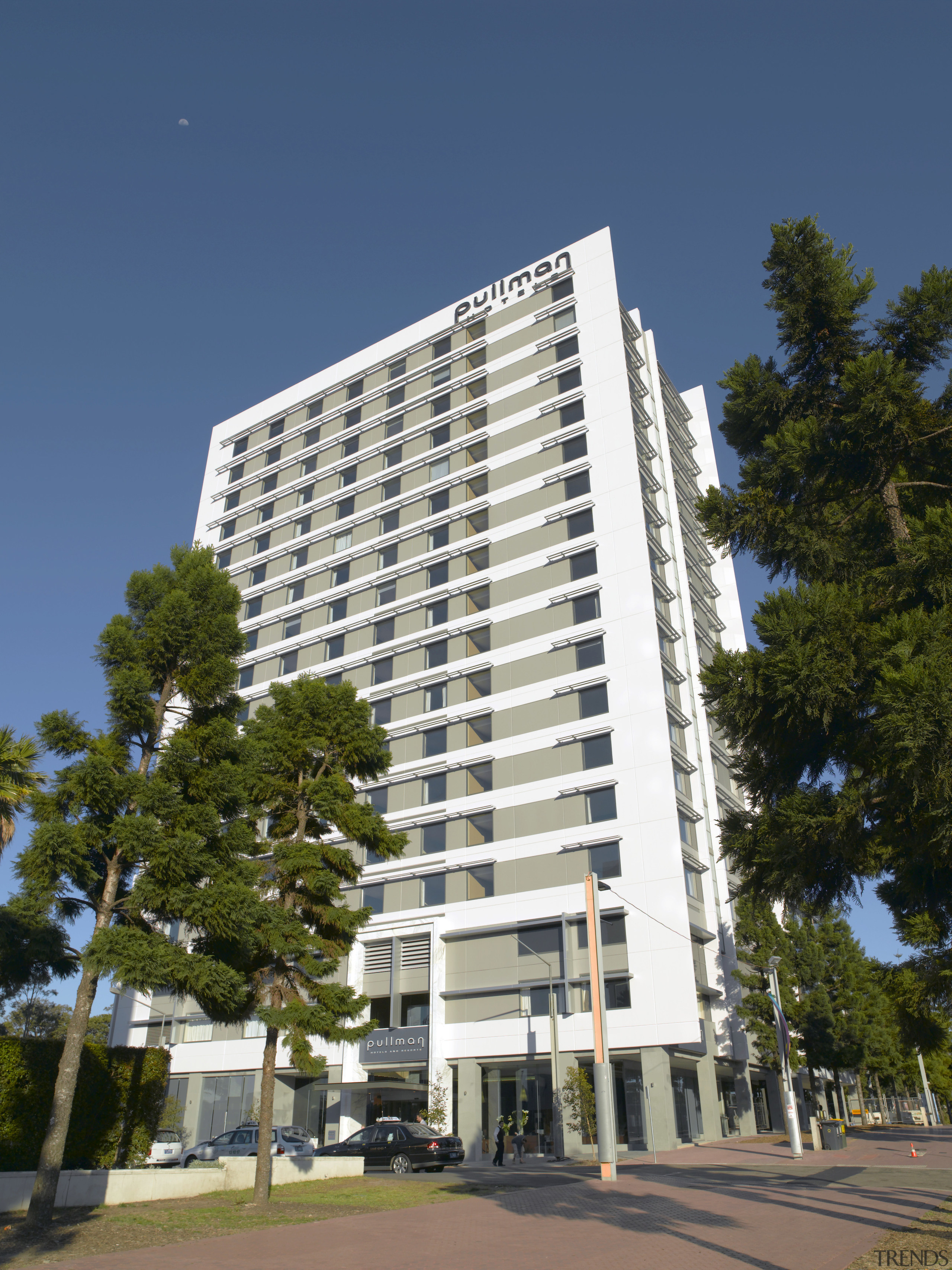 Exterior view of the Pullman hotel where the apartment, architecture, building, commercial building, condominium, corporate headquarters, daytime, facade, headquarters, hotel, metropolis, metropolitan area, mixed use, neighbourhood, property, real estate, residential area, sky, skyscraper, tower block, blue