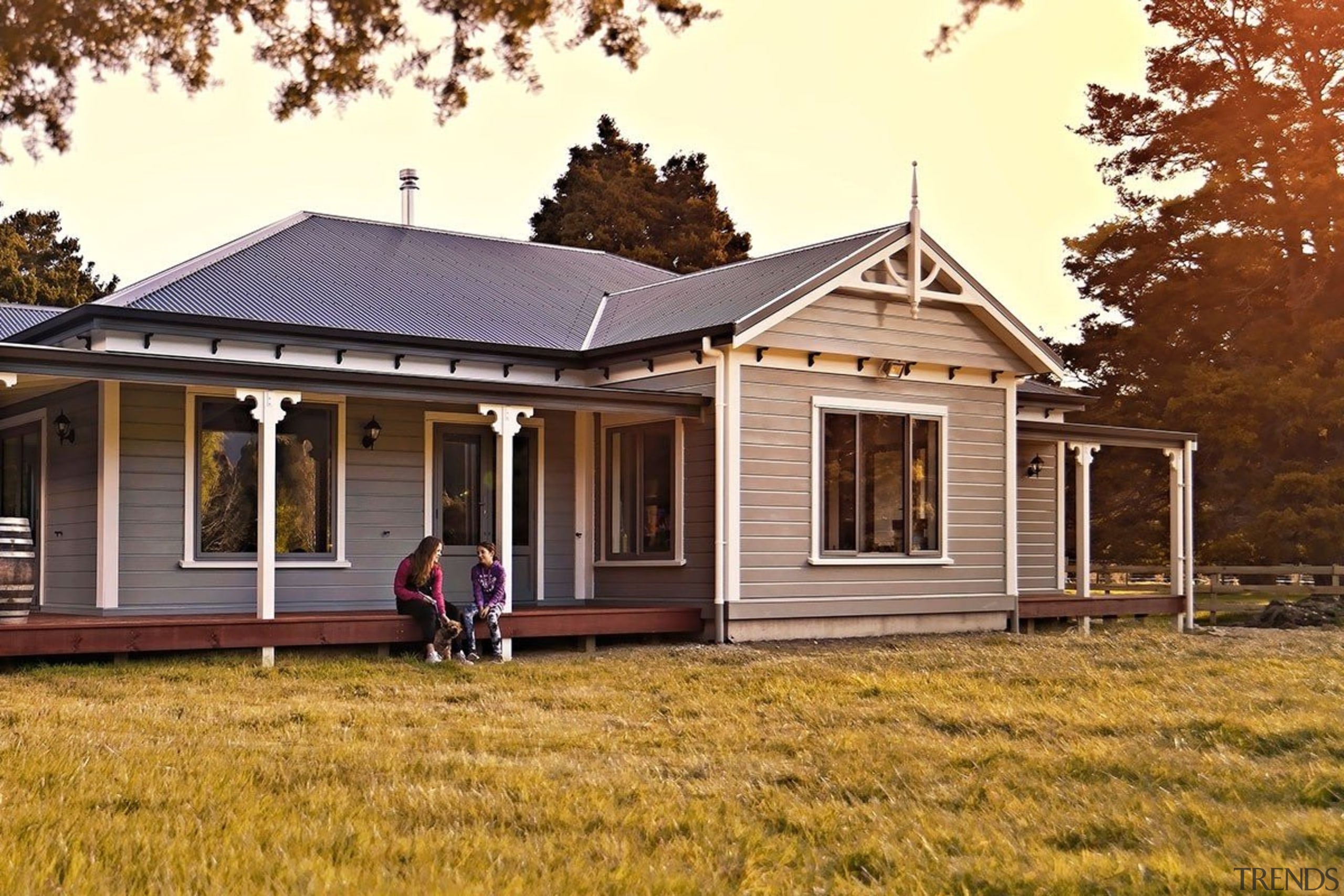 Family living in a home built with Niagara cottage, estate, facade, farmhouse, home, house, property, real estate, siding, brown