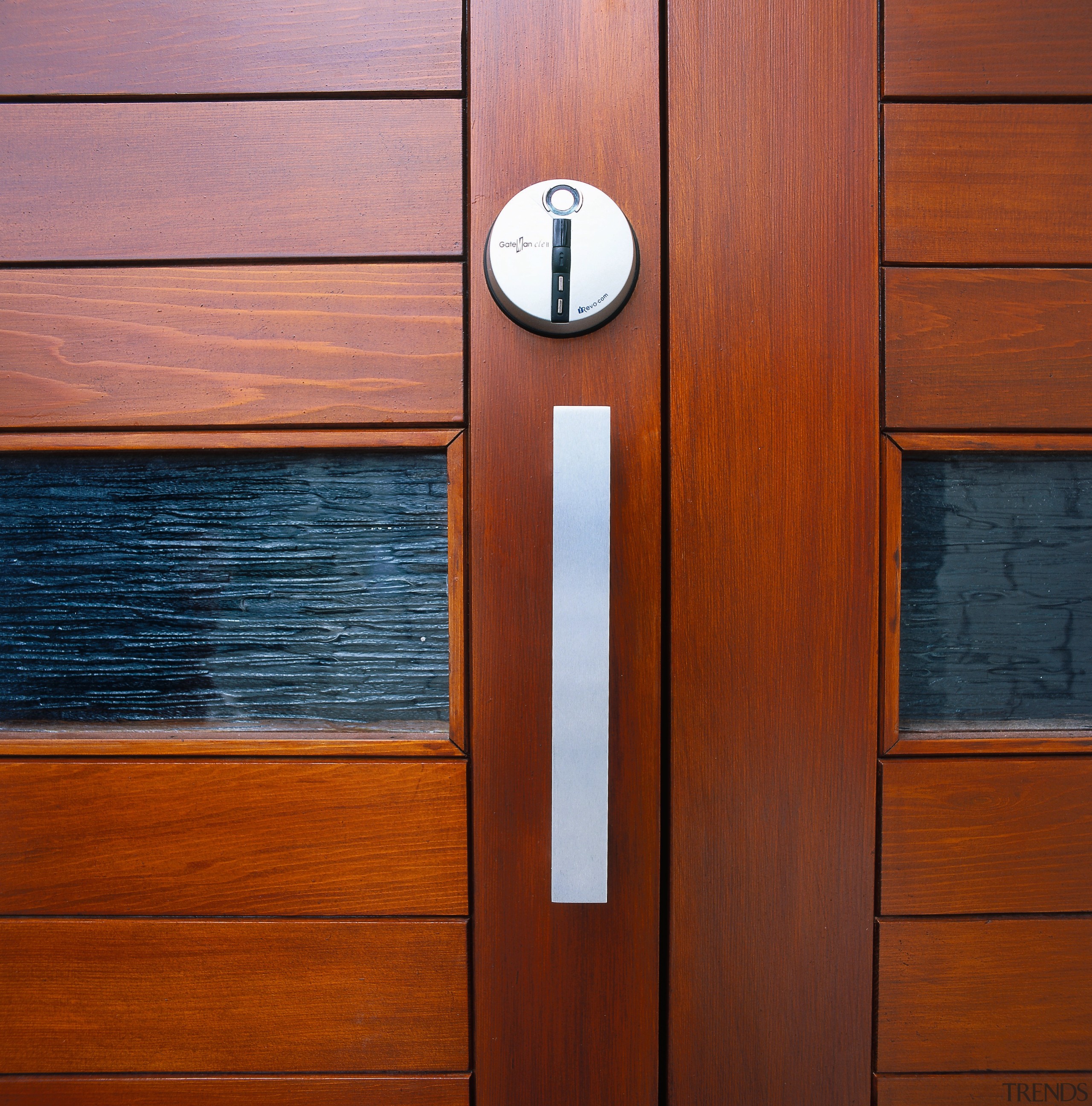 View of a wooden front door with panels cabinetry, door, hardwood, wood, wood flooring, wood stain, red, brown