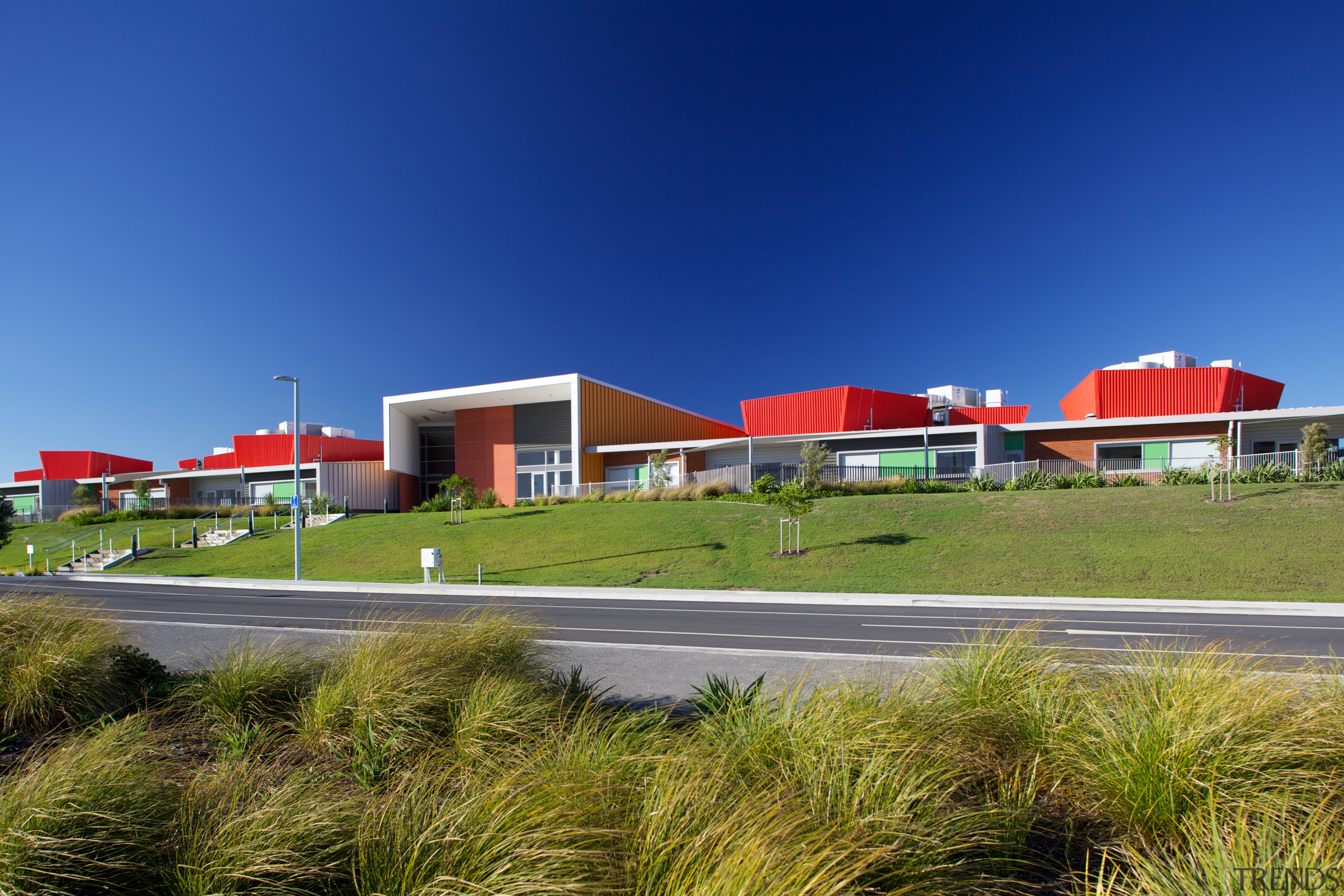 Hobsonville Point Primary School, built before the Hobsonville architecture, corporate headquarters, daytime, estate, home, house, metropolitan area, property, real estate, residential area, sky, suburb, blue, brown